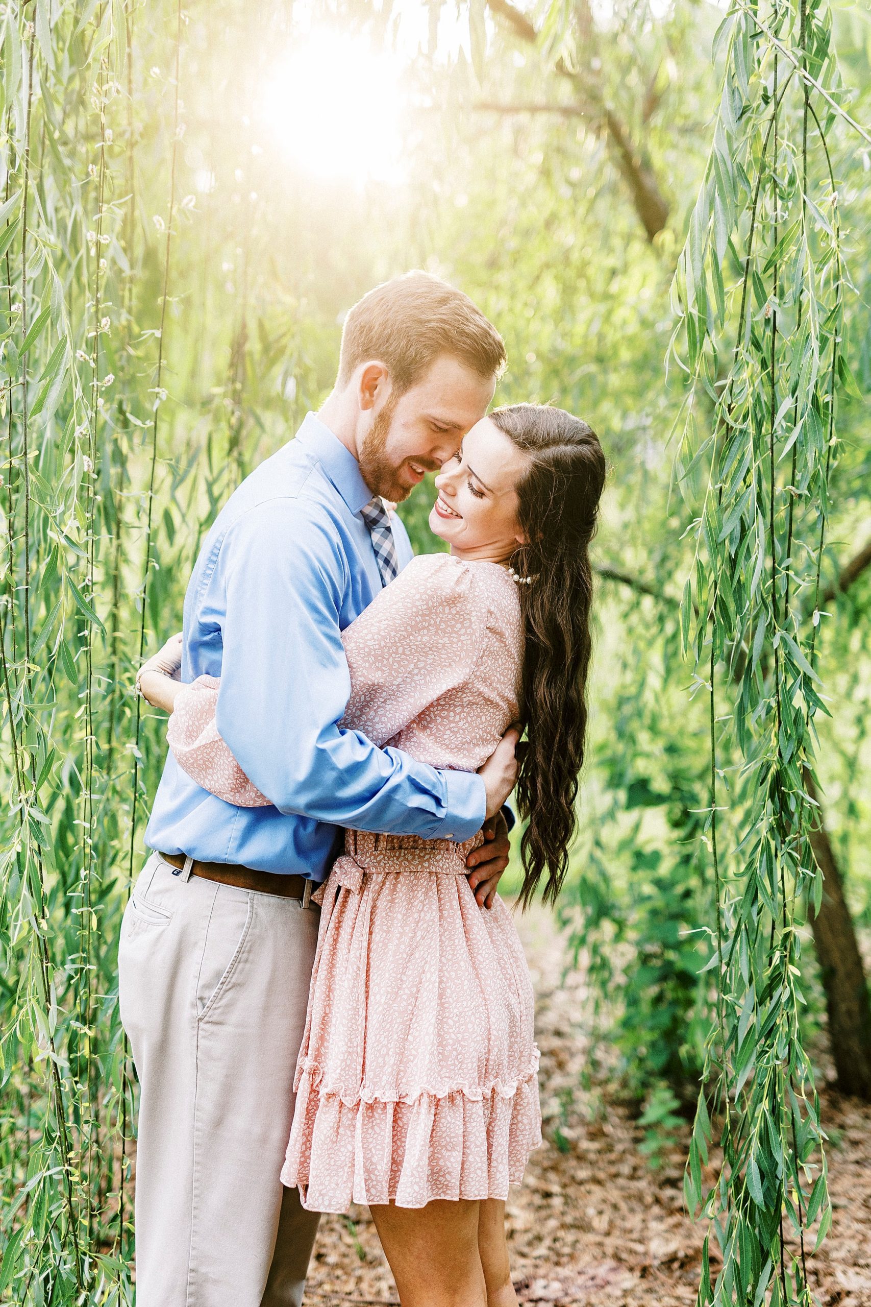groom nuzzles bride's cheek during SC engagement photos