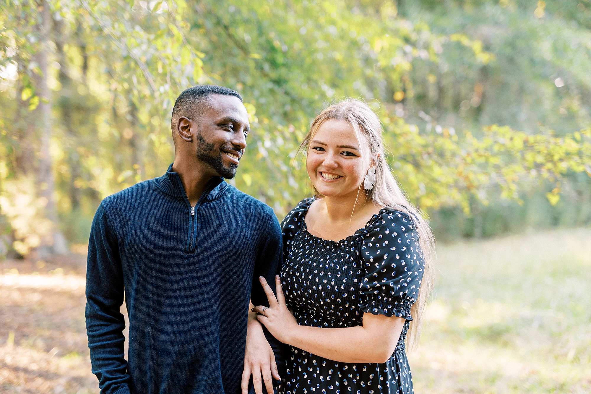 man laughs at fiancee during Bella Terra engagement session