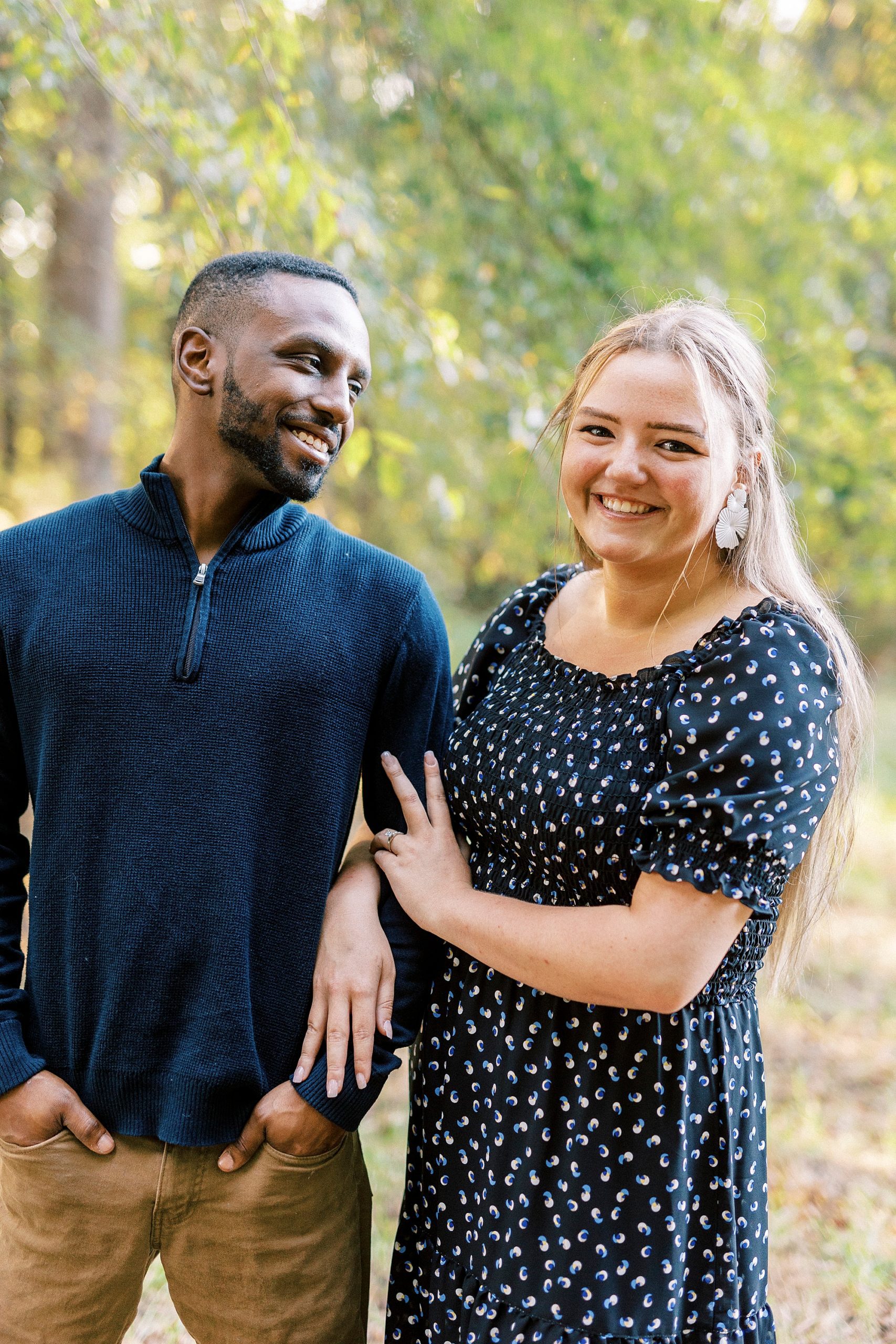 groom smiles looking at fiancee during fall Bella Terra engagement session