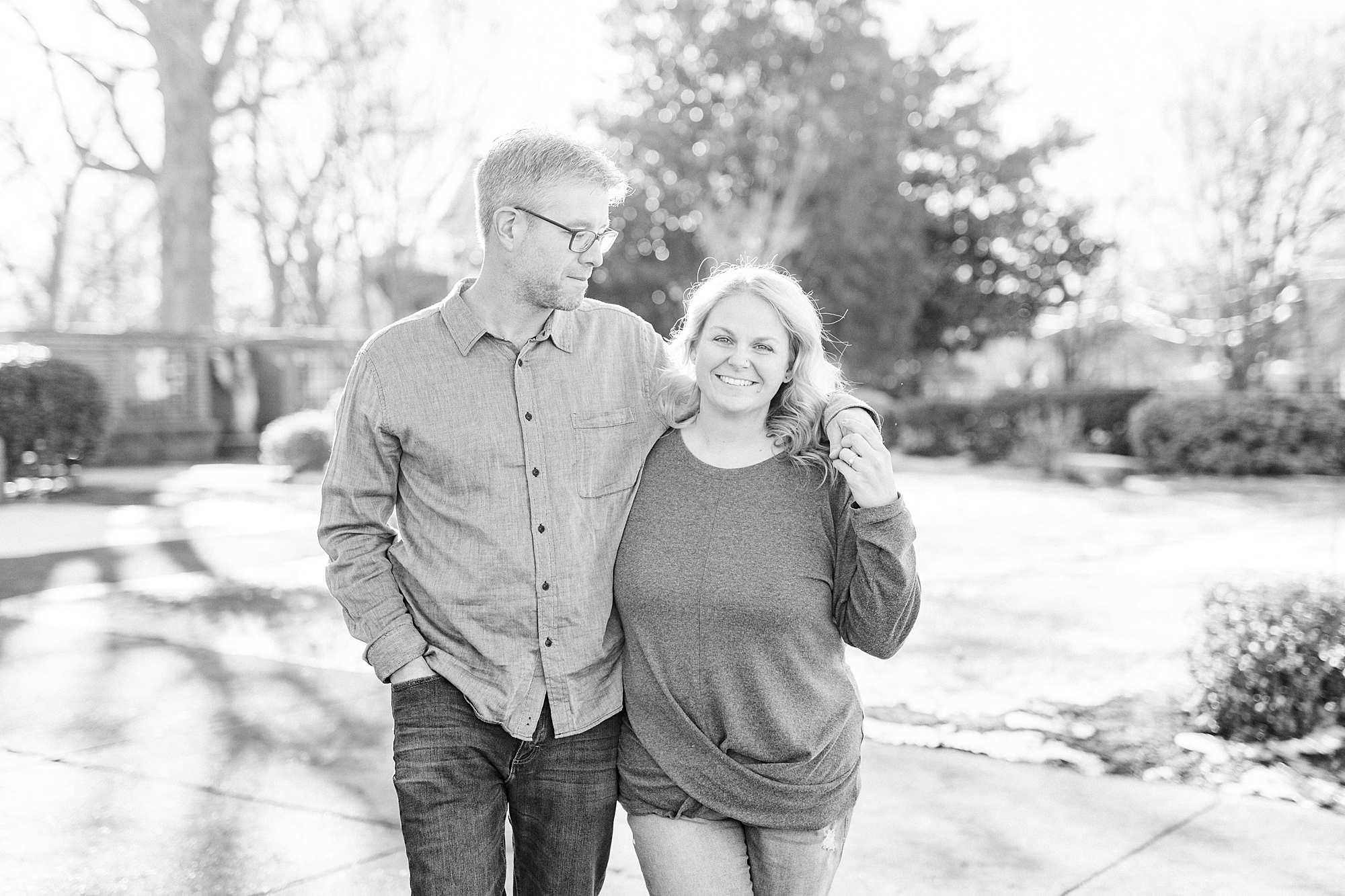 couple walks through park In downtown Monroe