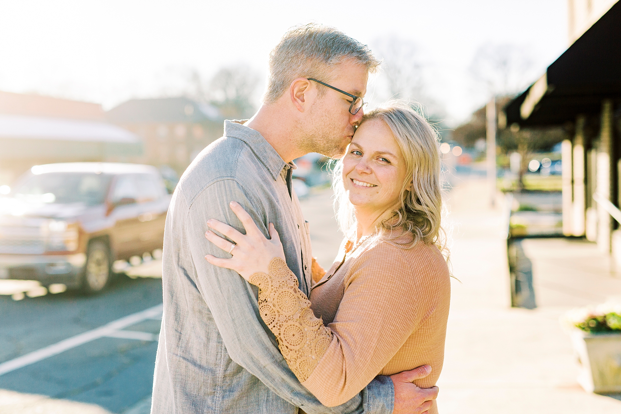 bride and groom hug during fall engagement session in NC