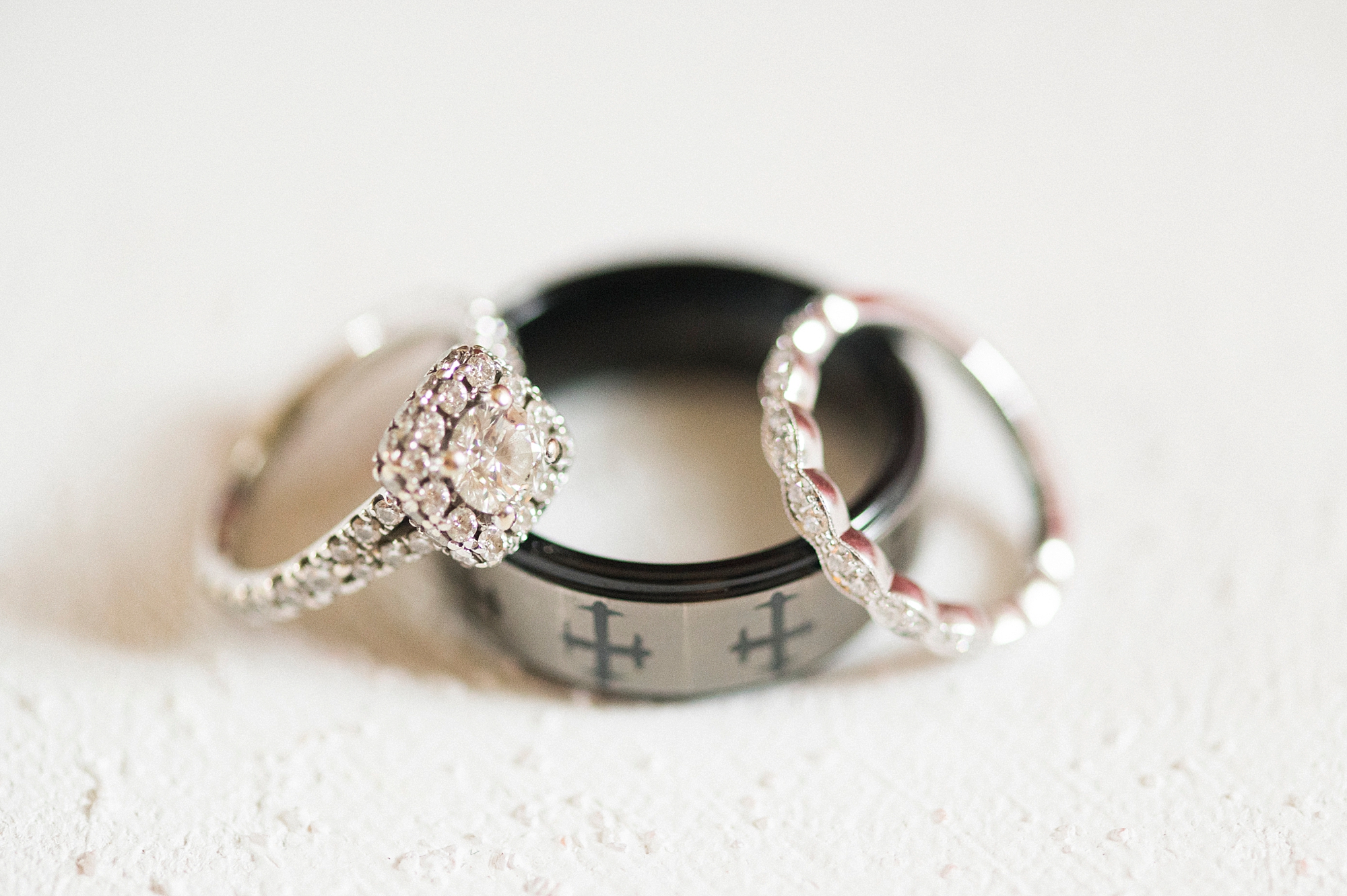 three wedding bands lay together