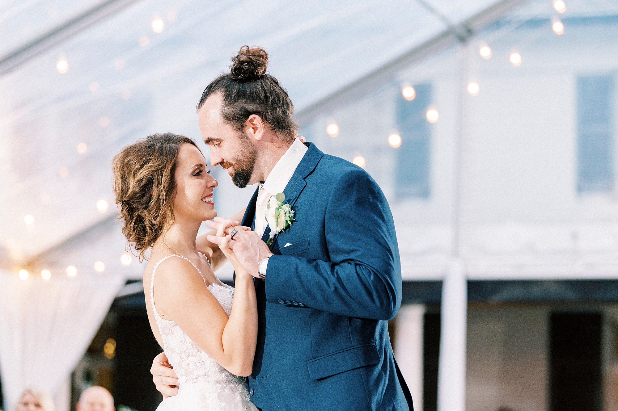 newlyweds dance under tent at Boxwood Estate
