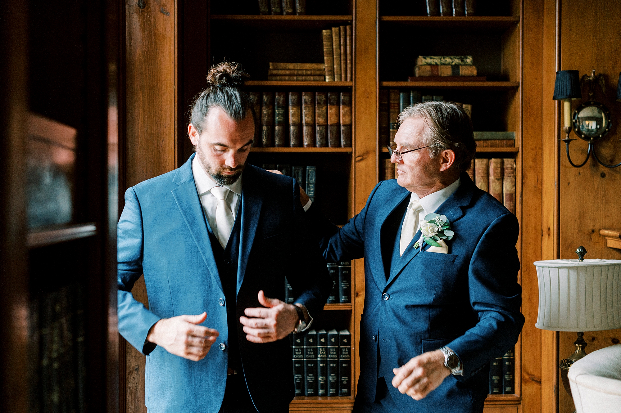 father helps groom prepare for NC wedding