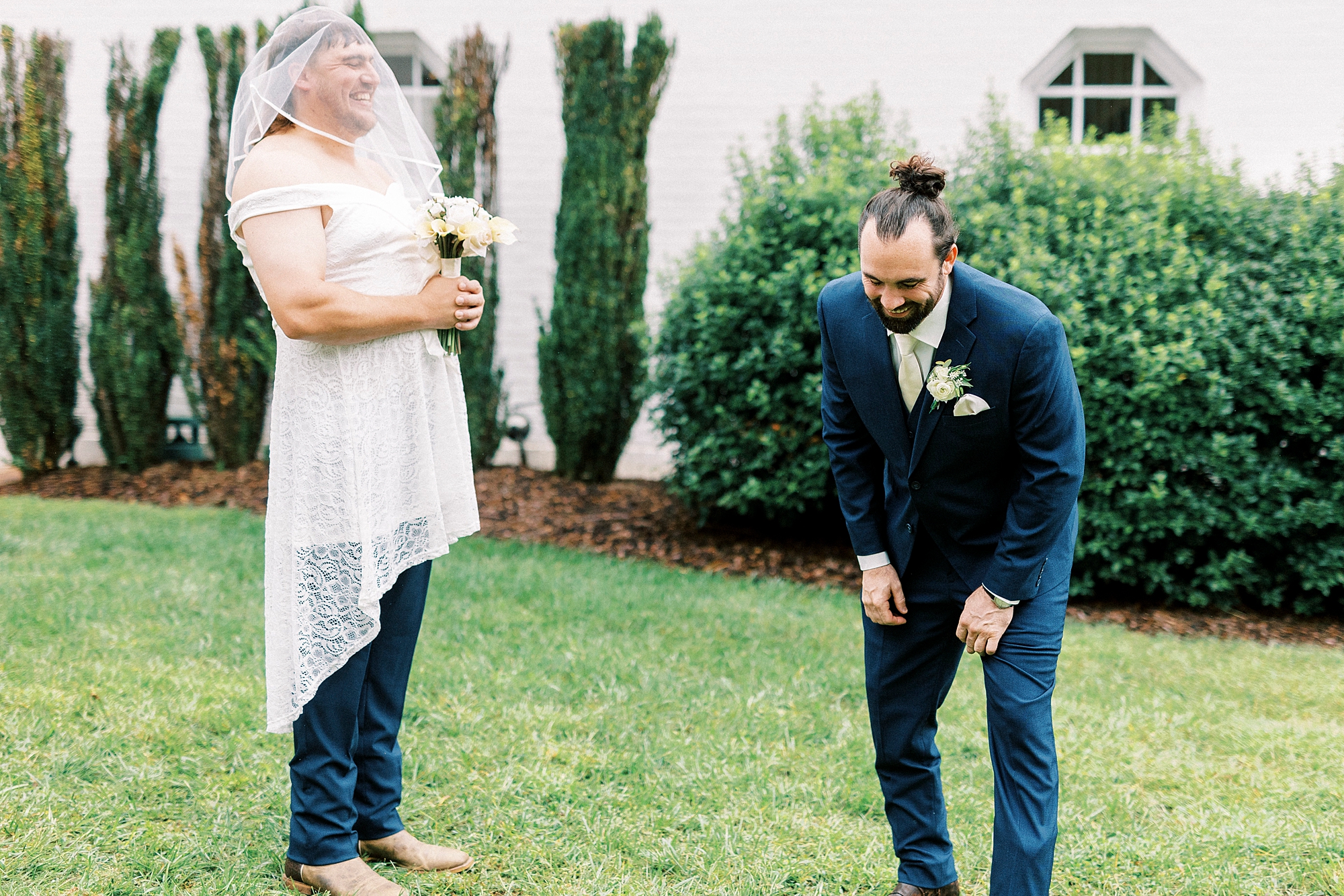 groomsman dresses in wedding dress with bouquet of flowers for groom