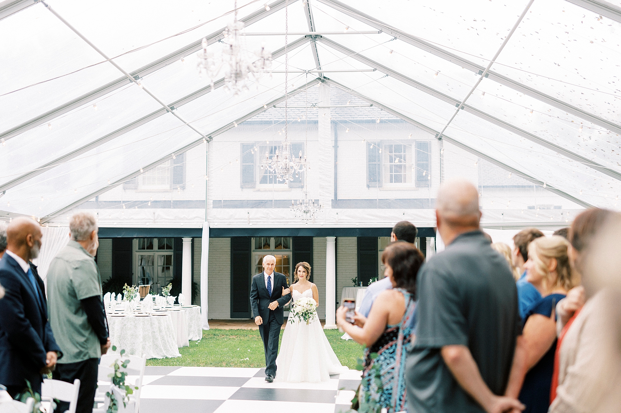 bride walks down aisle with dad for ceremony at Boxwood Estate