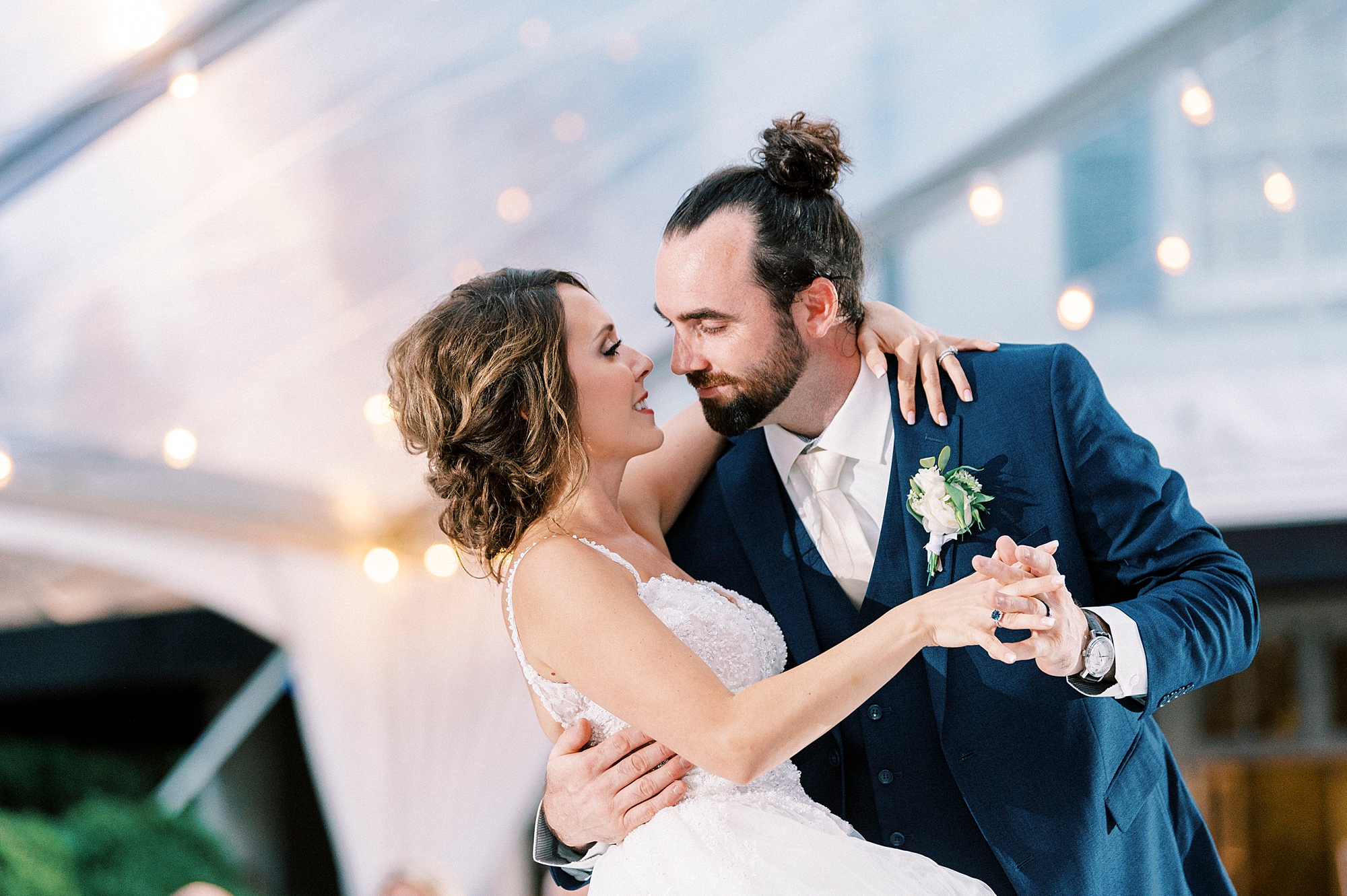 groom dips bride during reception at Boxwood Estate