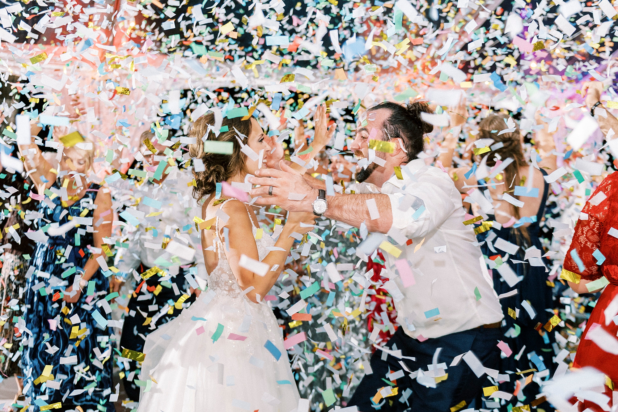 bride and groom dance during Mocksville NC wedding reception while confetti falls