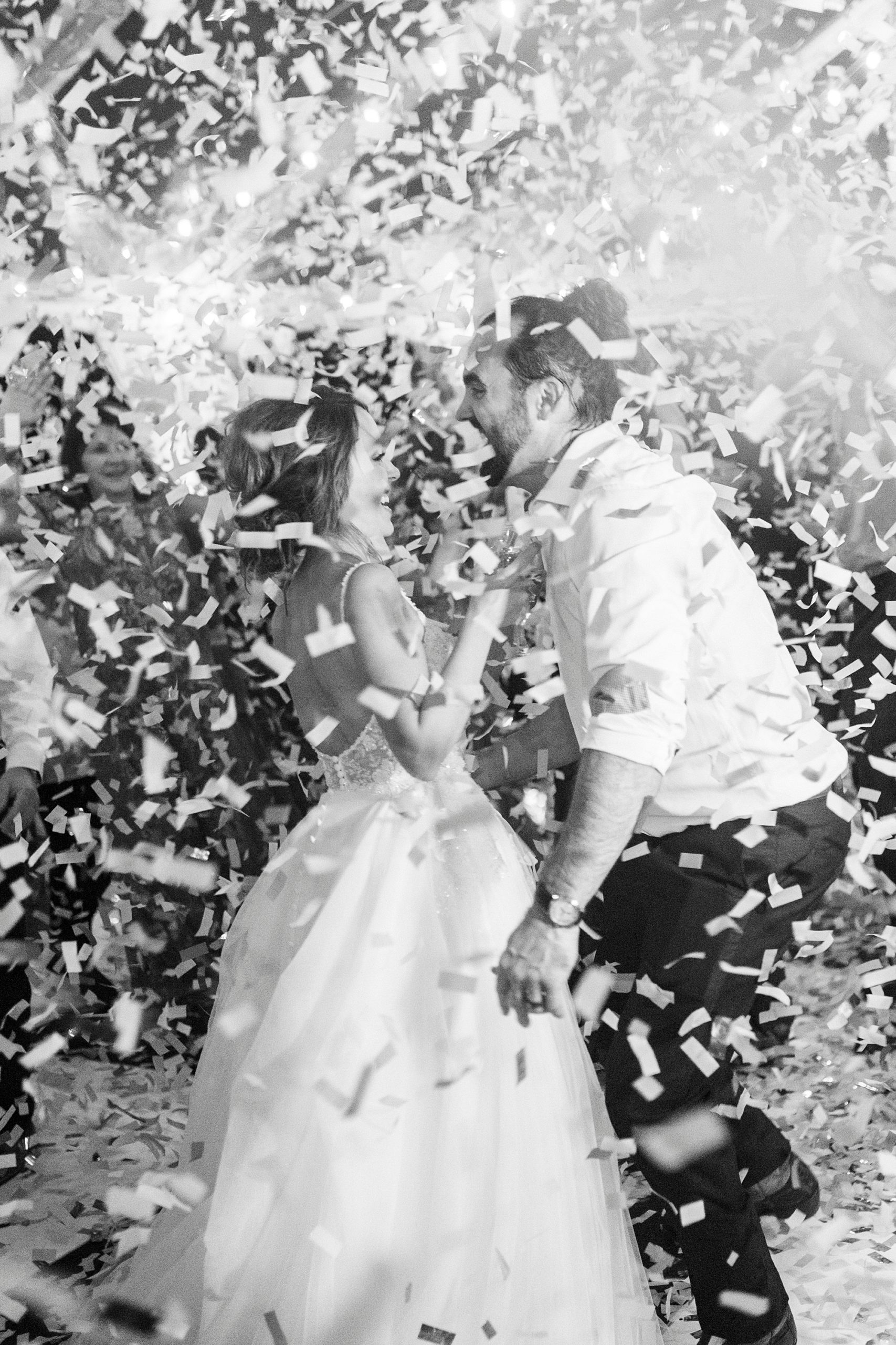 bride and groom dance during Mocksville NC wedding reception while confetti falls