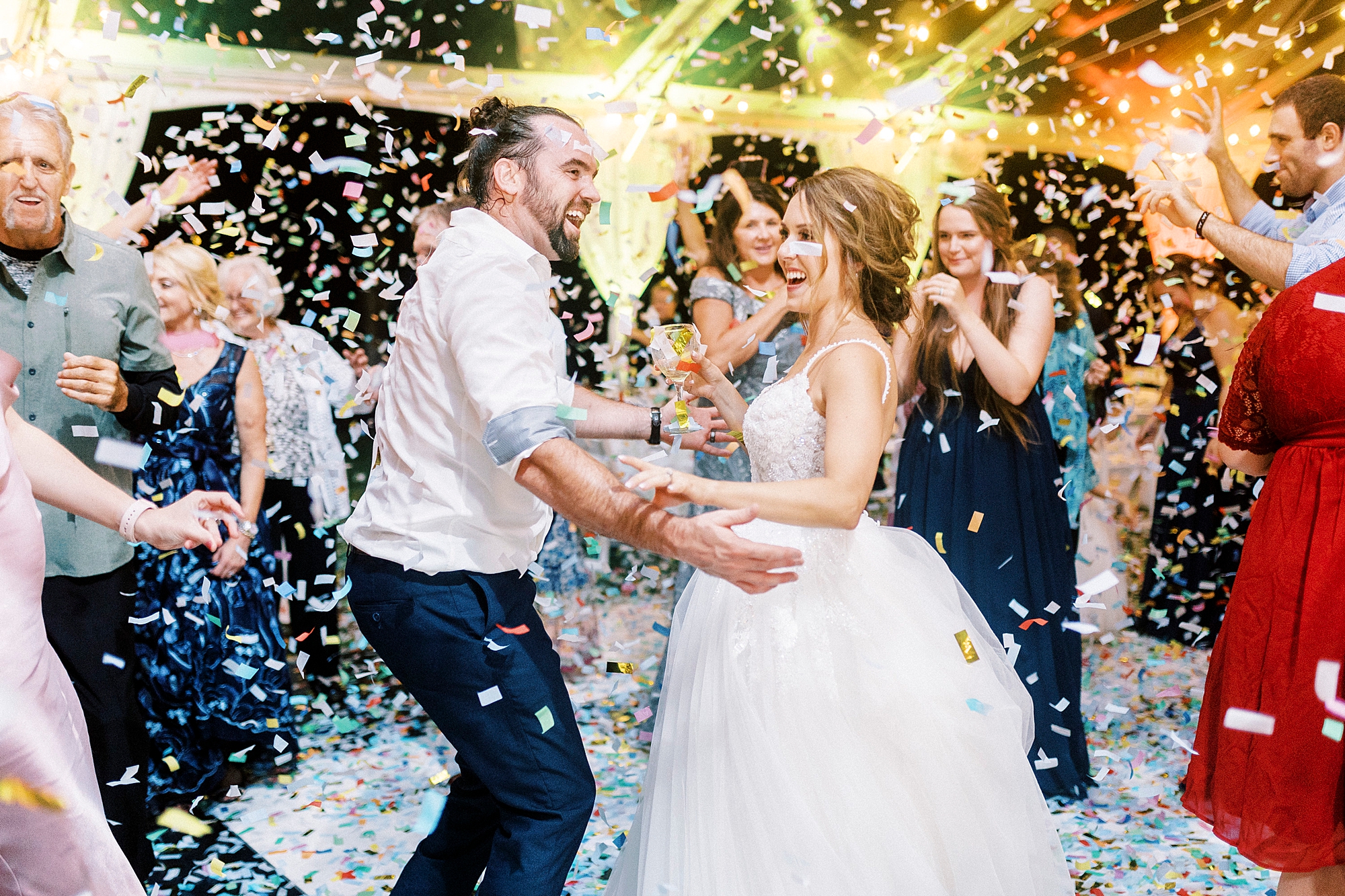 bride and groom dance during Mocksville NC wedding reception while confetti falls