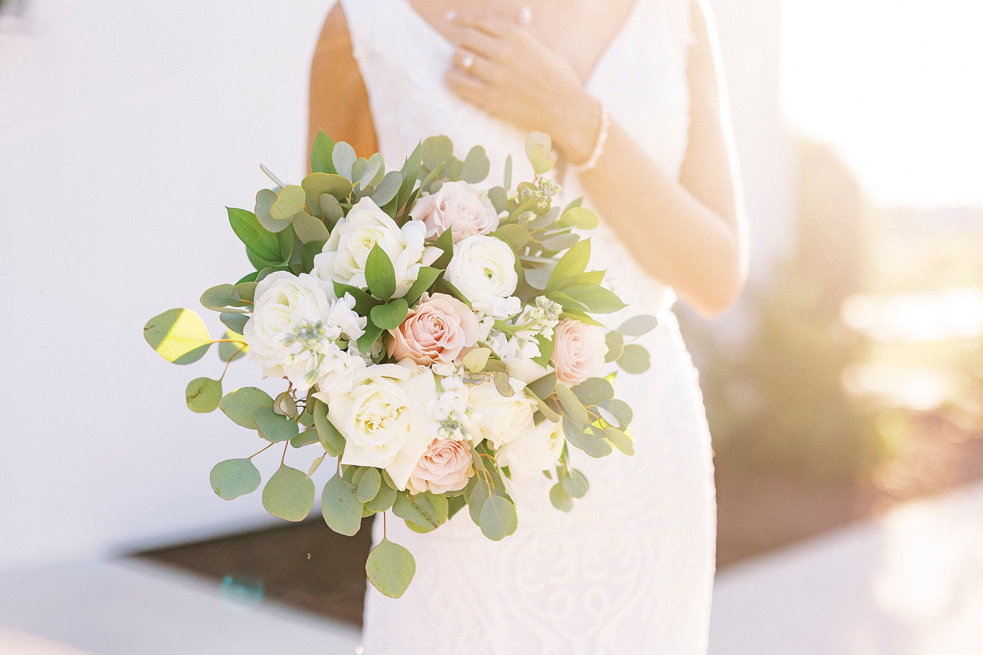 bride poses with white and pink bouquet during Chickadee Hill Farms bridal portraits 