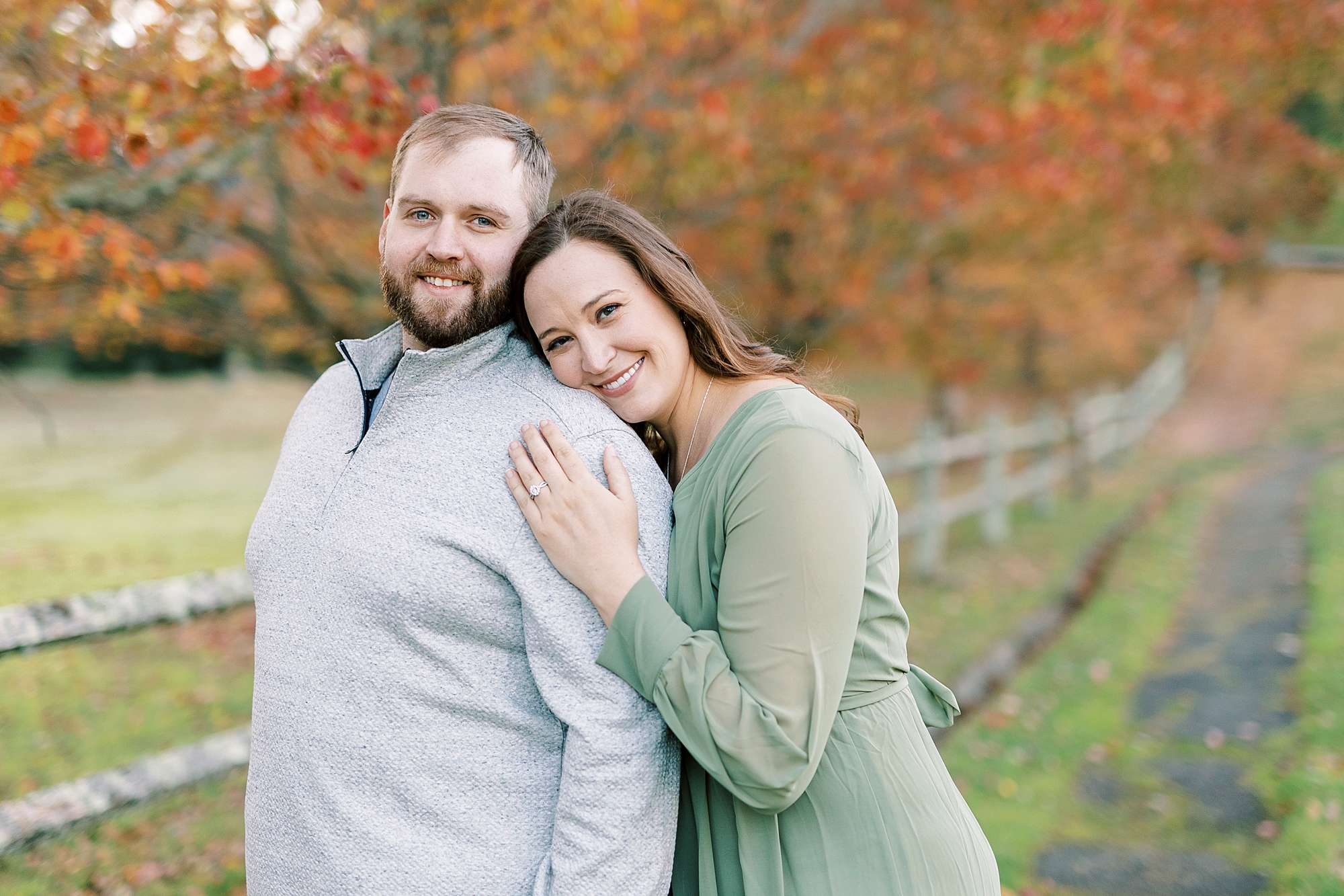 bride leans on groom's back during fall Chetola Resort engagement session