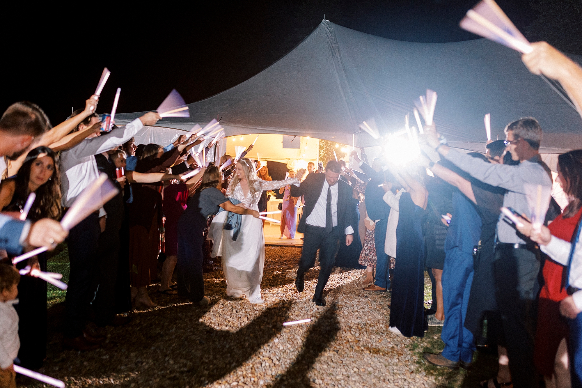 newlyweds leave Blowing Rock NC wedding reception in sparkler exit