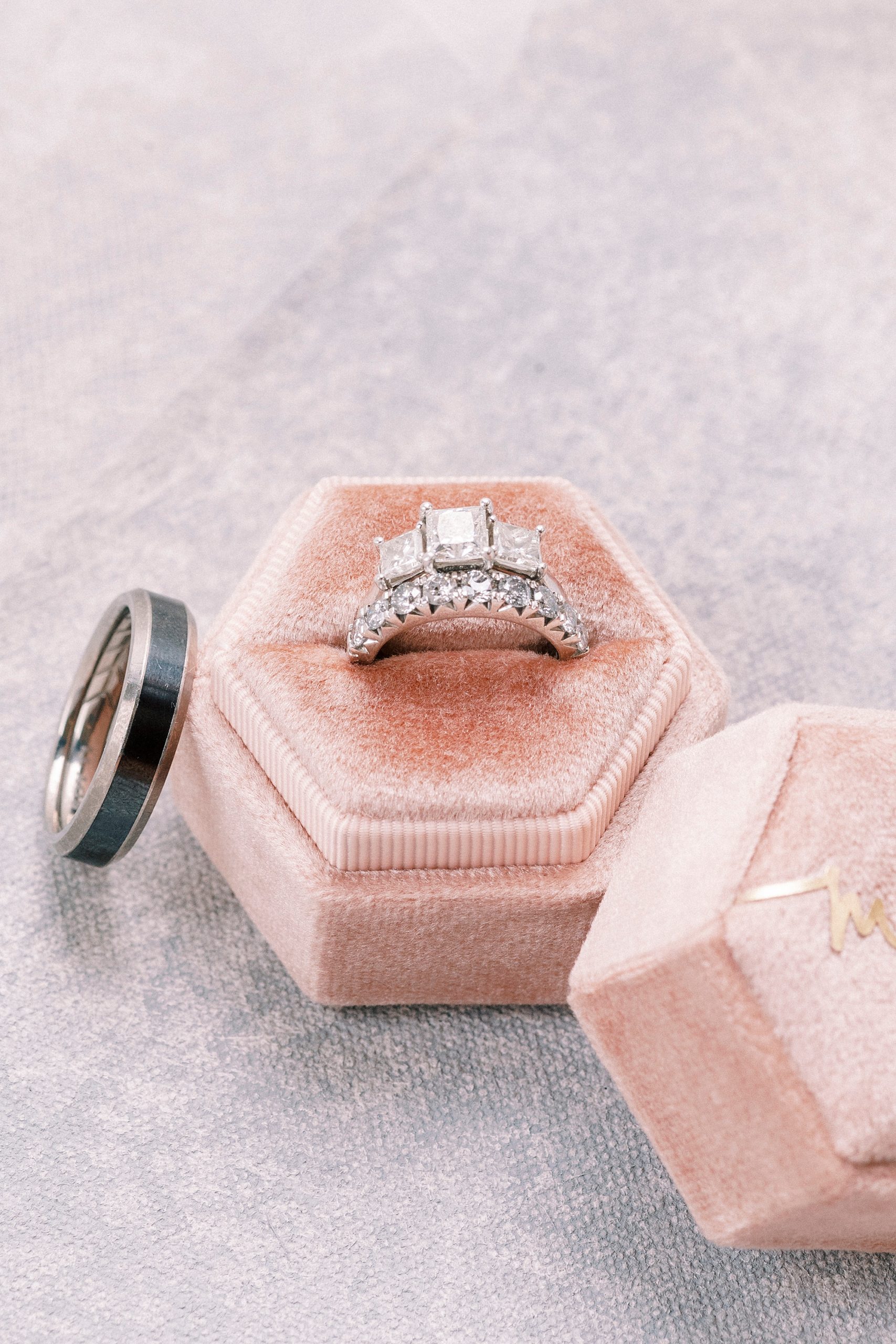 wedding rings rest in pink box