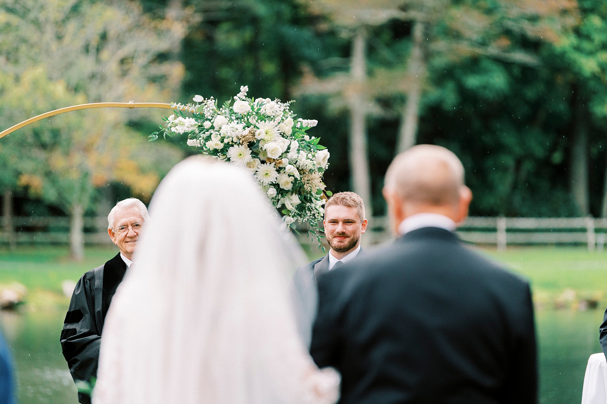 groom watches bride walk down aisle at Chetola Resort
