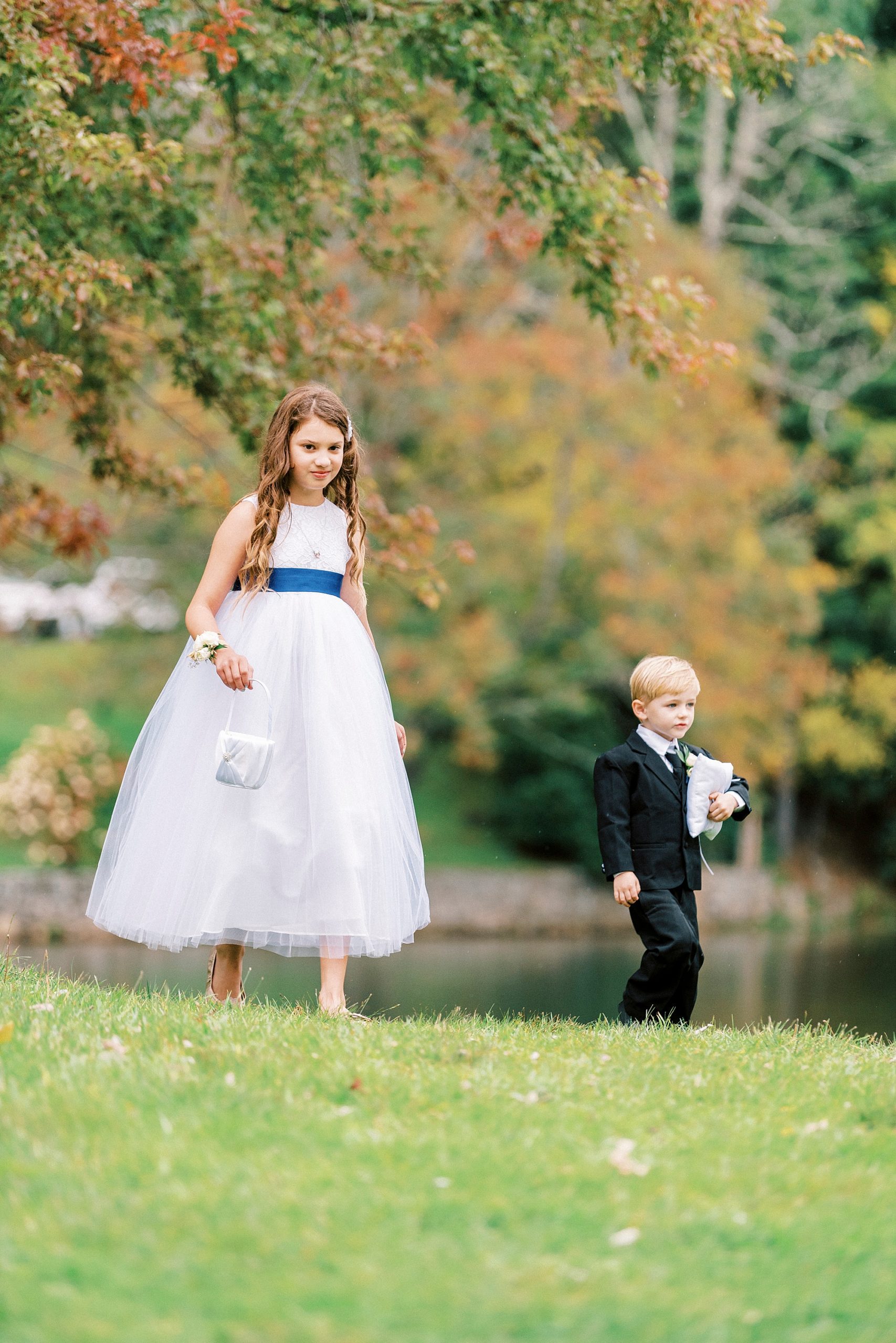 flower girl and ring bearer walk down aisle at Chetola Resort