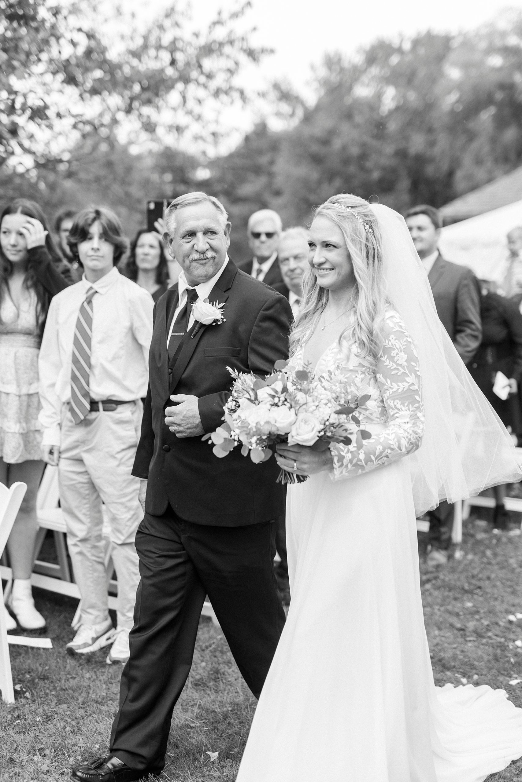 bride and dad walk down aisle at Chetola Resort