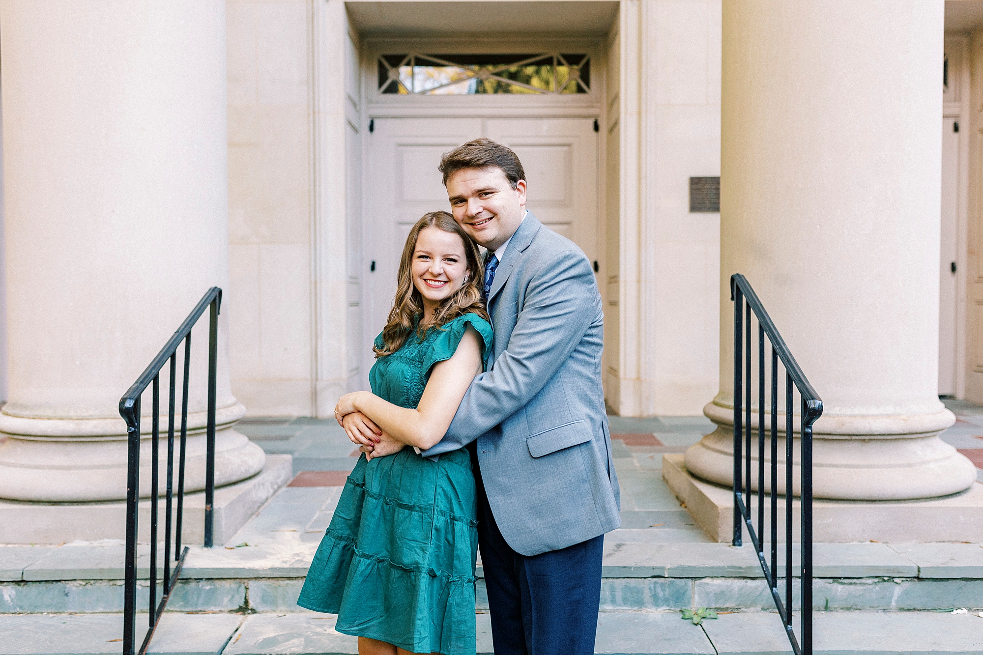 bride and groom hug outside courthouse in Downtown Davidson