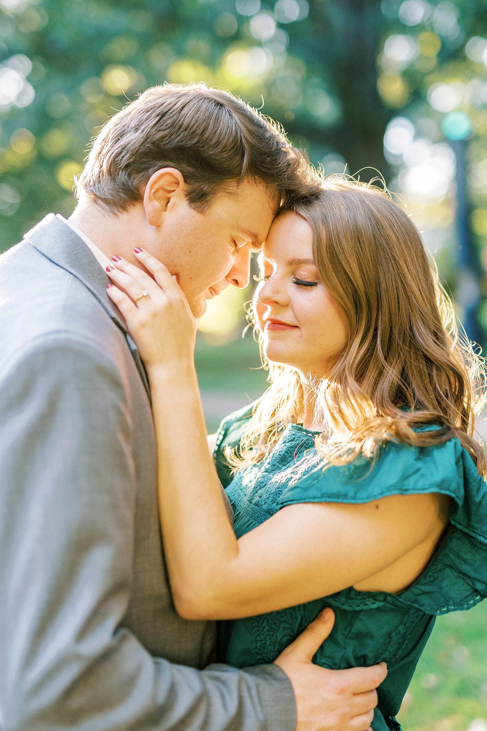 bride and groom hug during sunset in Downtown Davidson