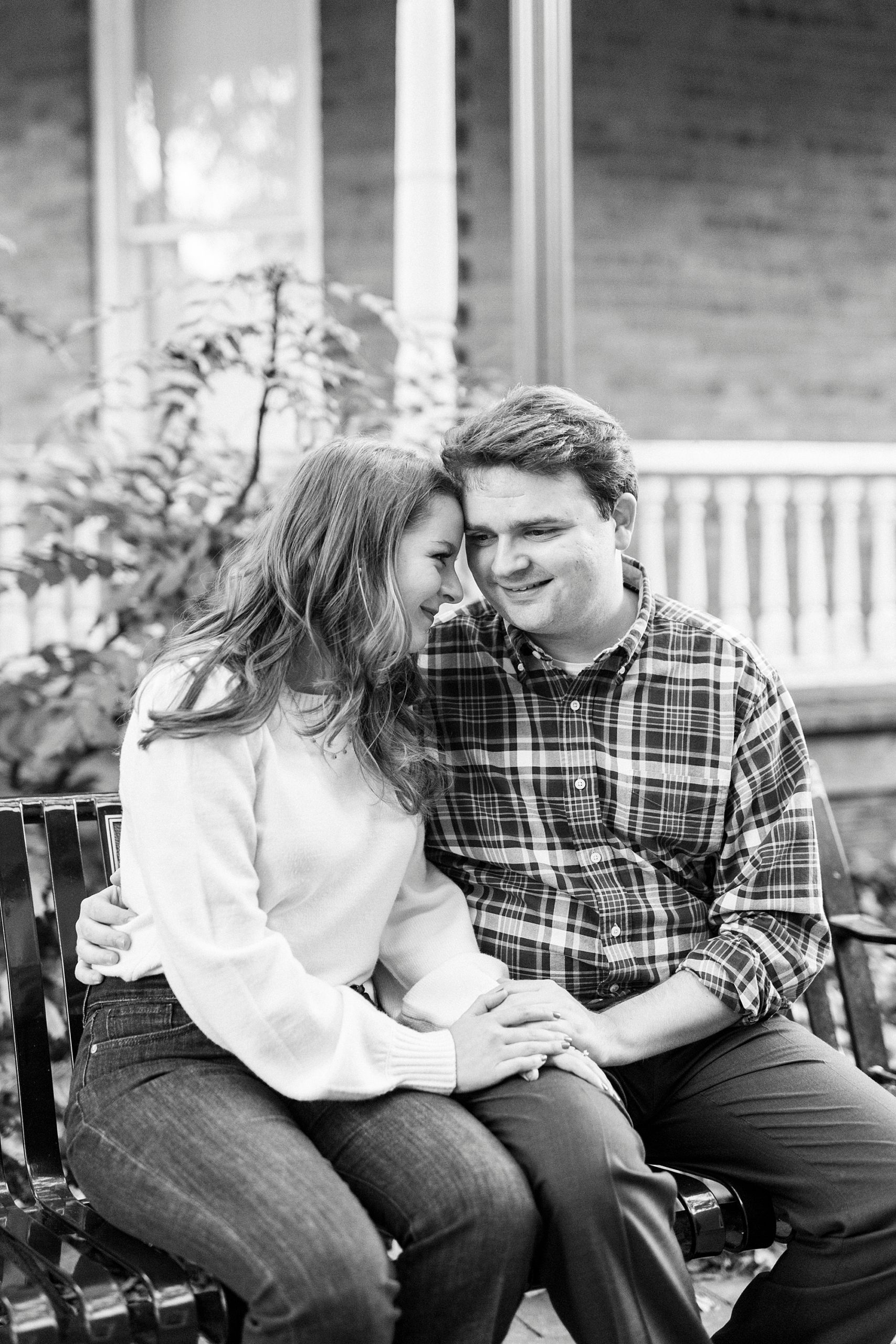 bride laughs leaning into groom during NC engagement session