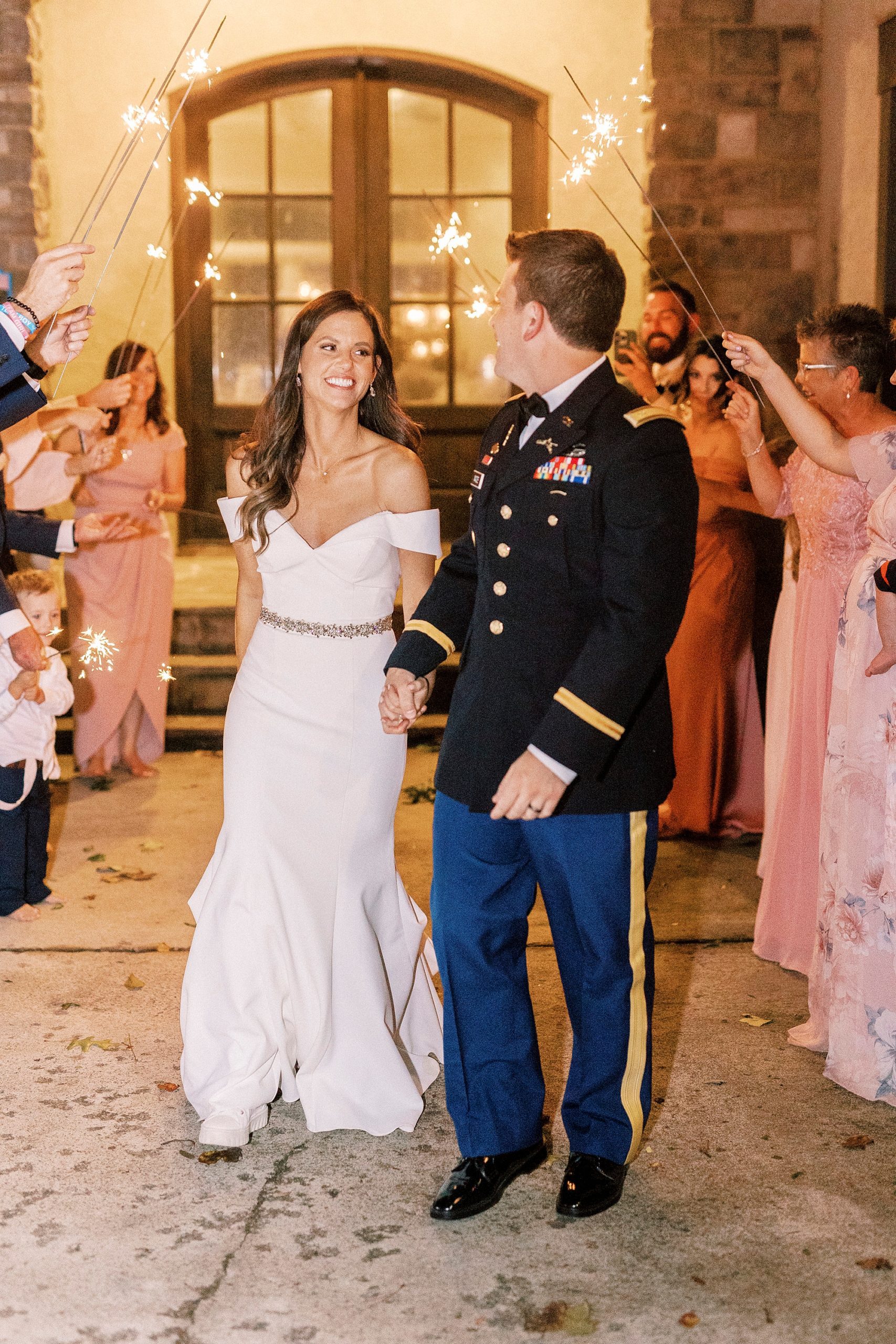 newlyweds leave reception during sparkler exit