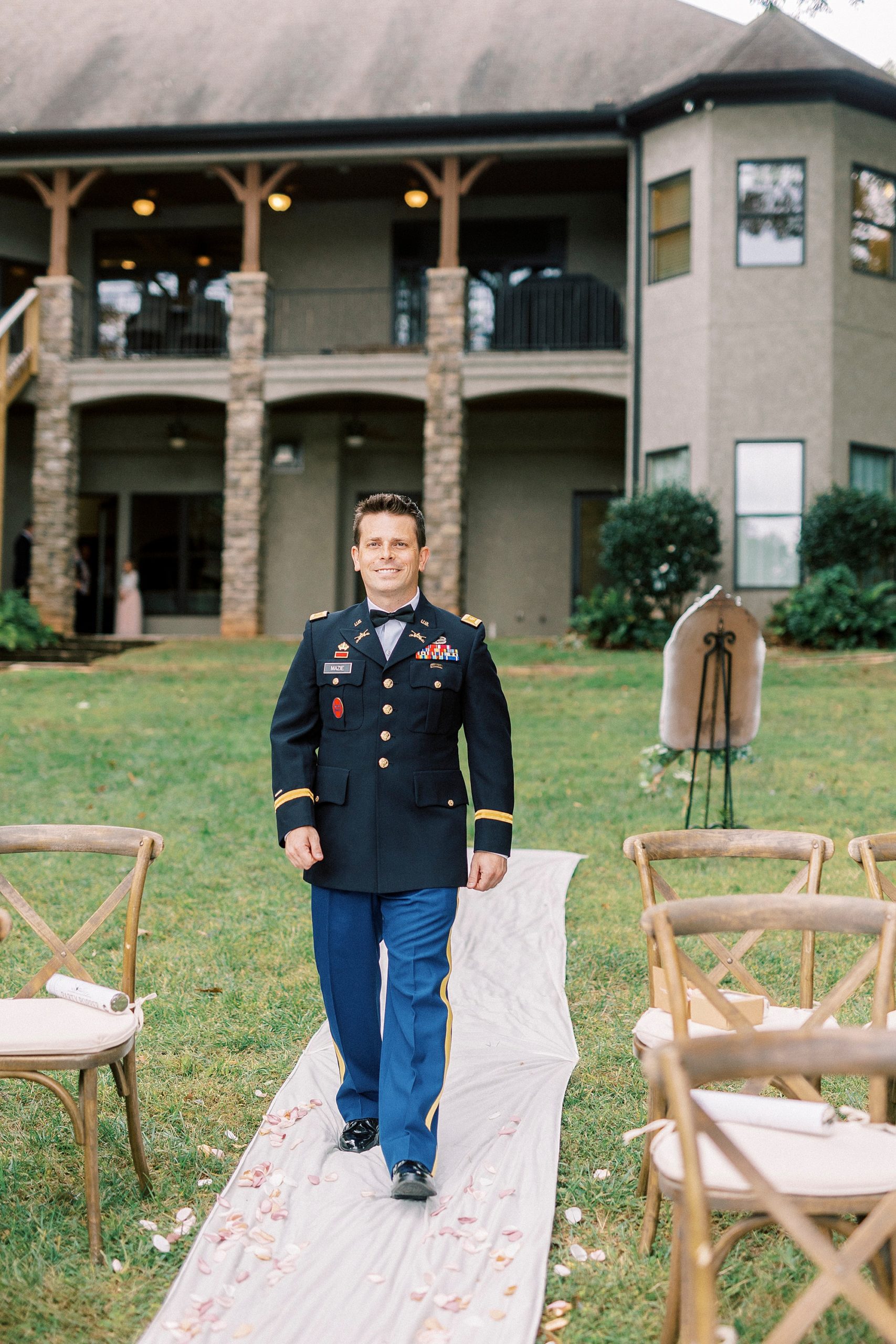 groom walks down aisle for Lake Norman wedding ceremony