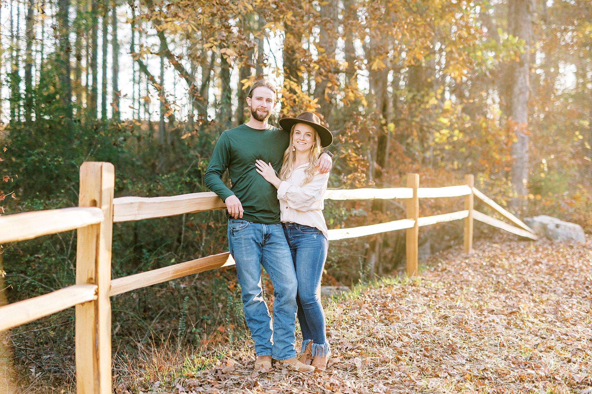 bride and groom lean against wooden fence in Richfield NC