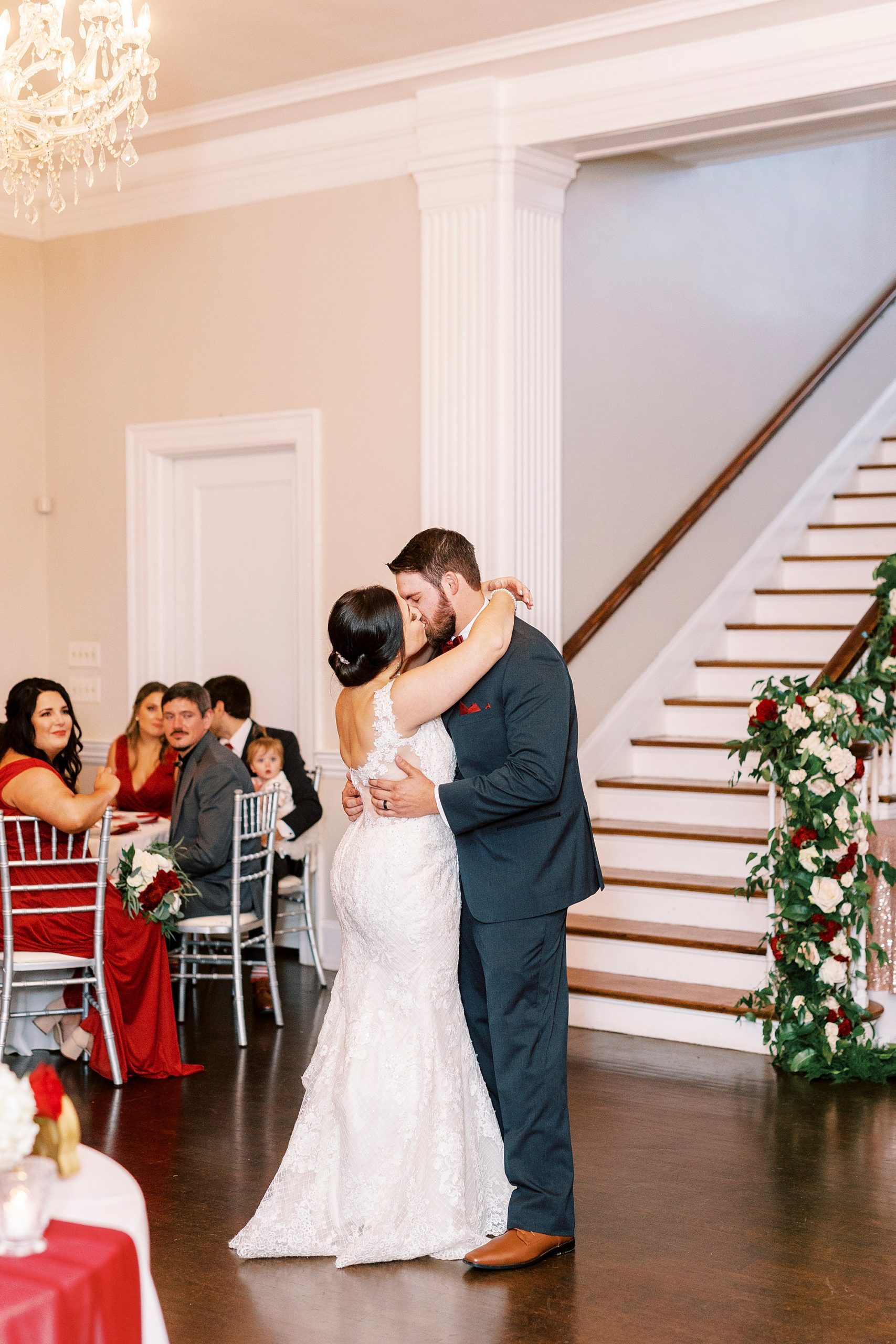 bride and groom kiss on dance floor