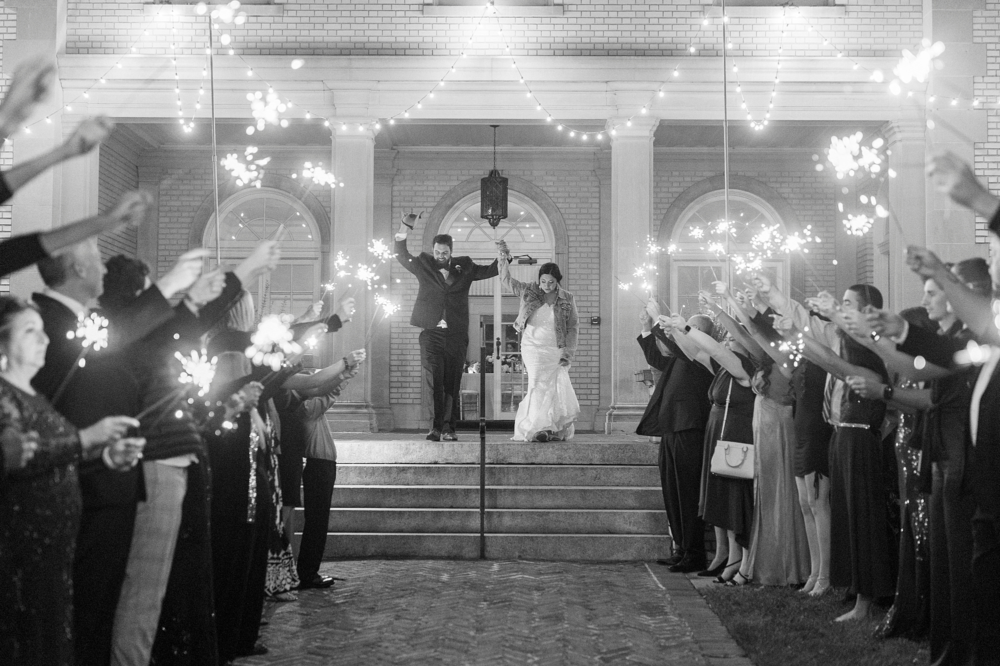 bride and groom cheer leaving Separk Mansion during sparkler exit