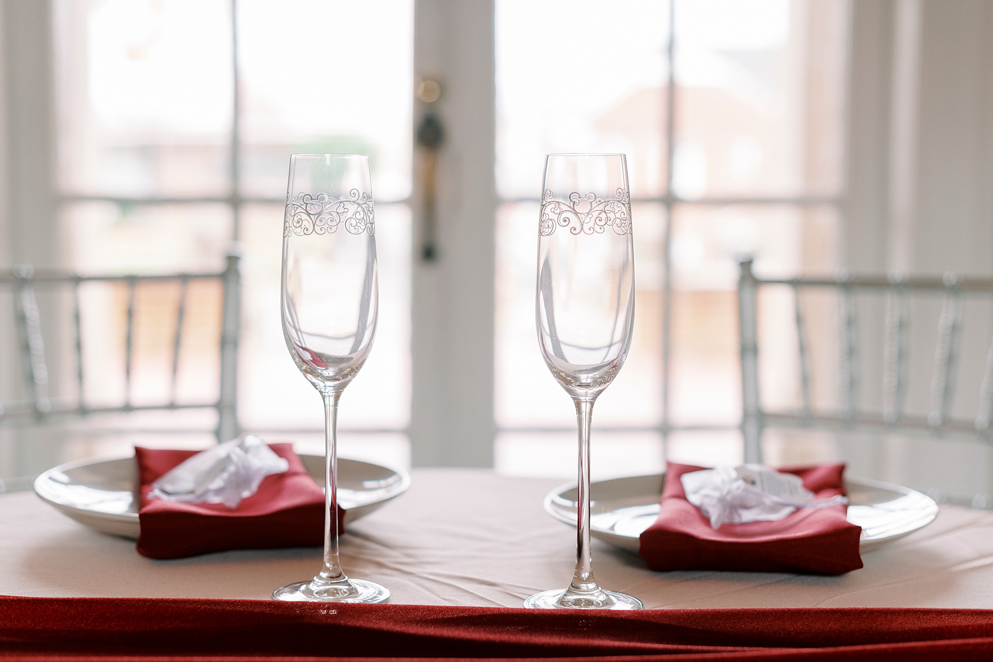 champagne glasses and plates on sweetheart table at Separk Mansion