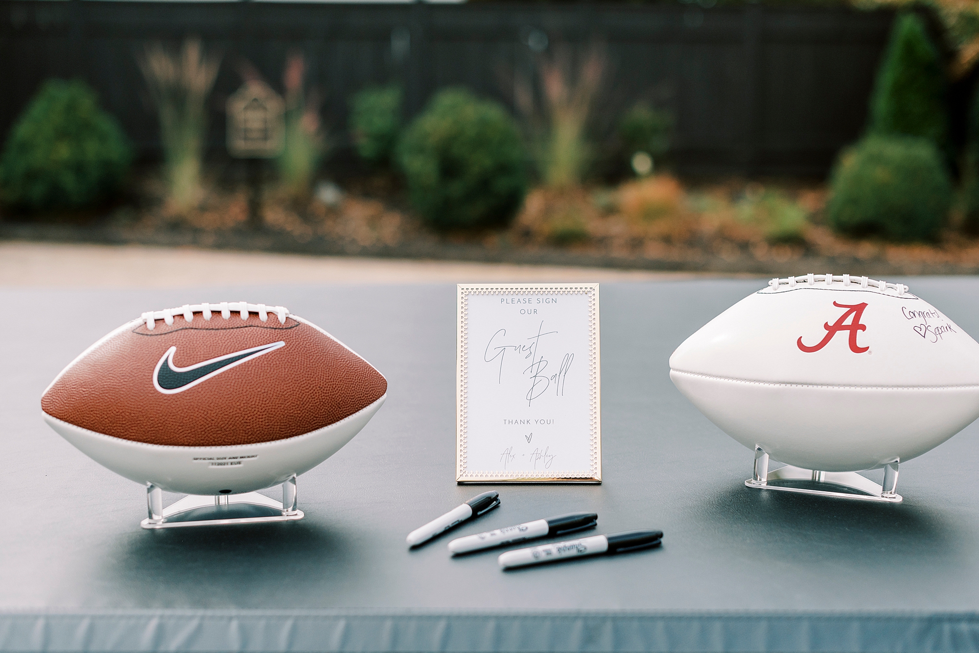 footballs for guest book rest on back of pickup truck