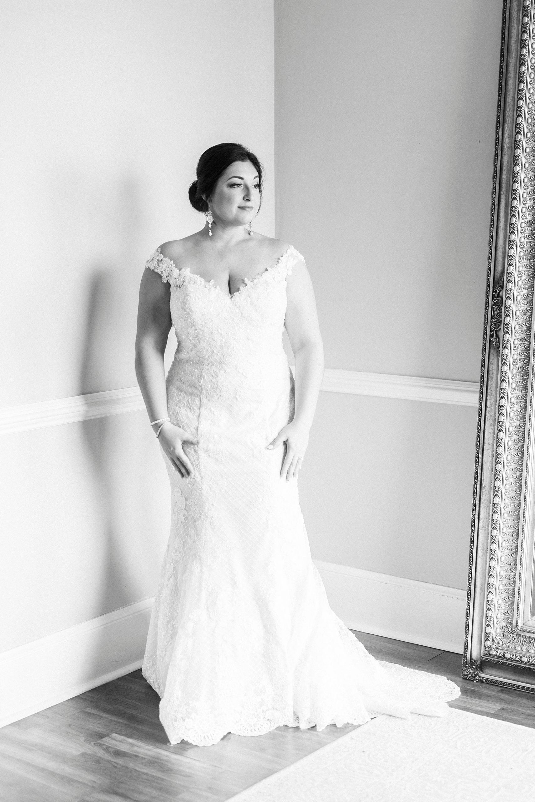 black and white portrait of bride standing in bridal suite at Separk Mansion