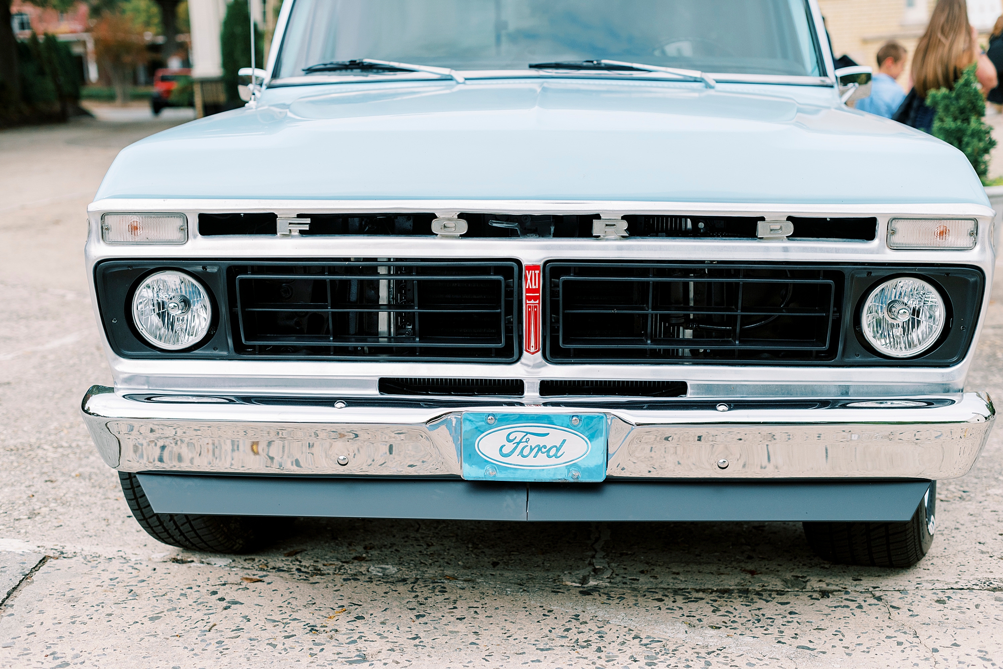 front of classic blue pickup truck for fall wedding at Separk Mansion