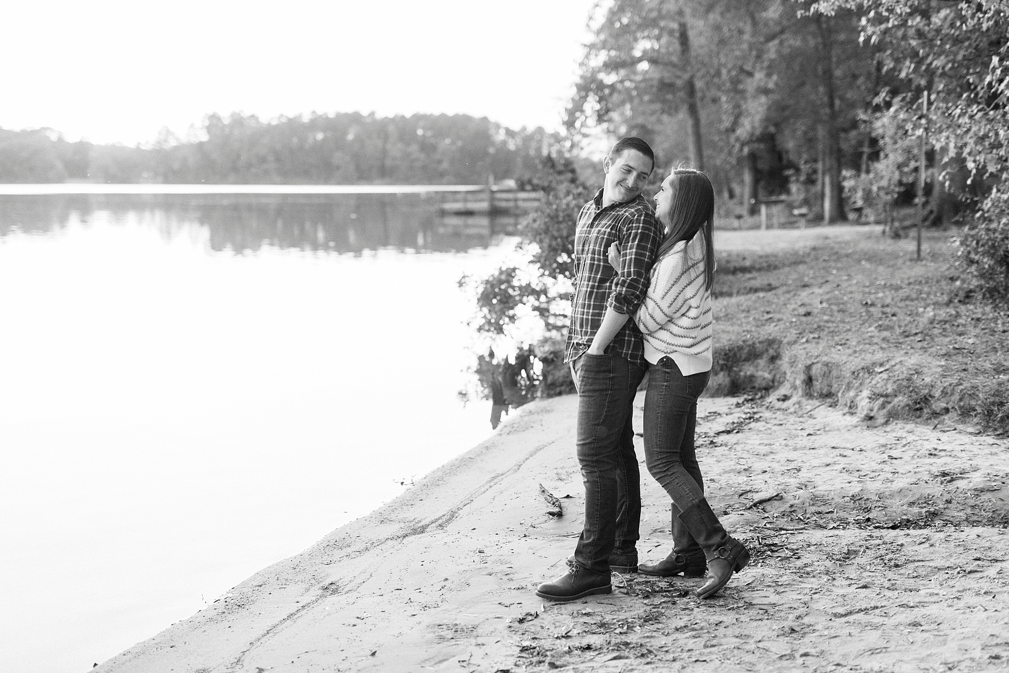bride hugs groom on beach at Latta Nature Preserve