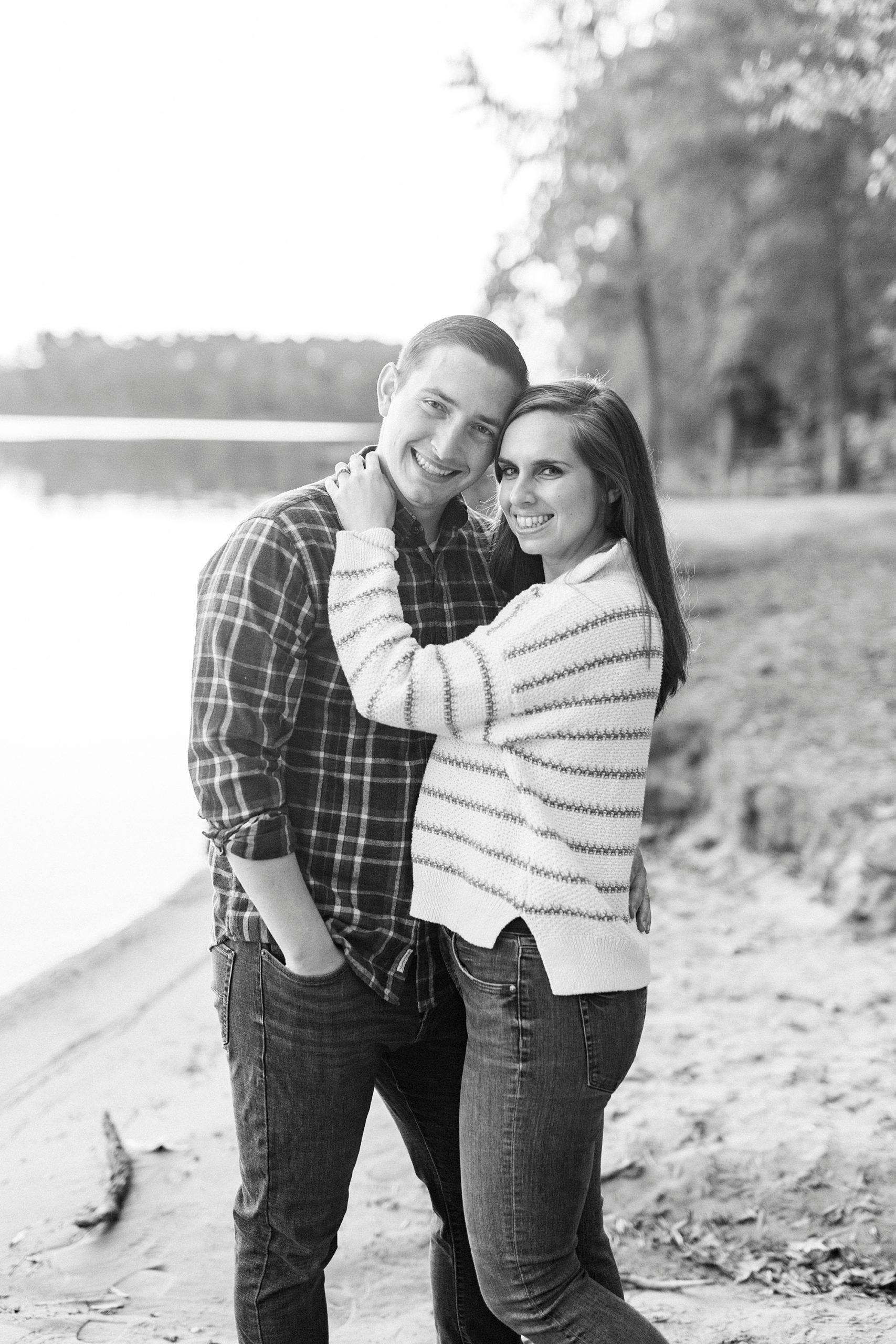 bride and groom hug during portraits on the beach at Latta Nature Preserve