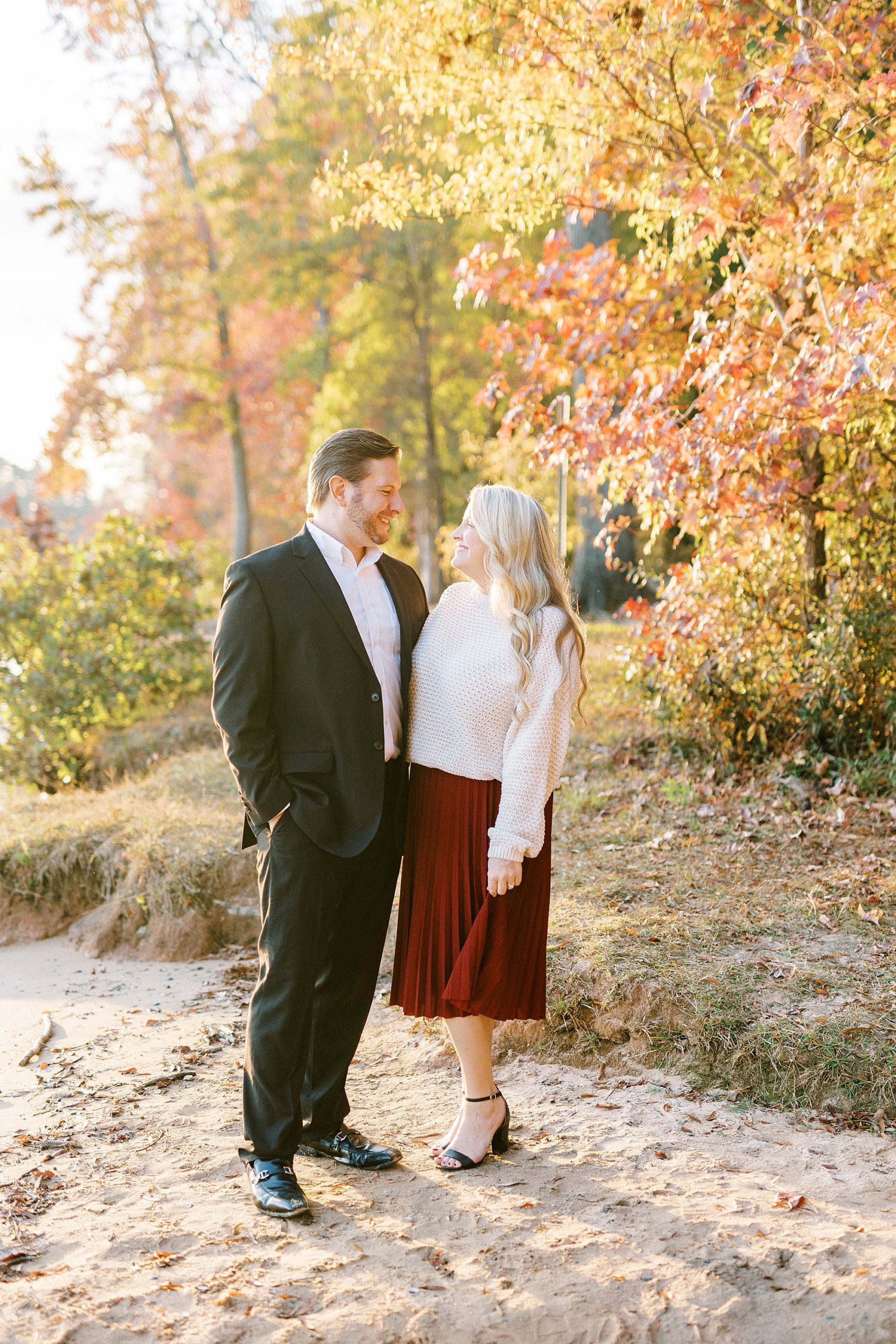 bride and groom hug smiling together at Latta Nature Preserve
