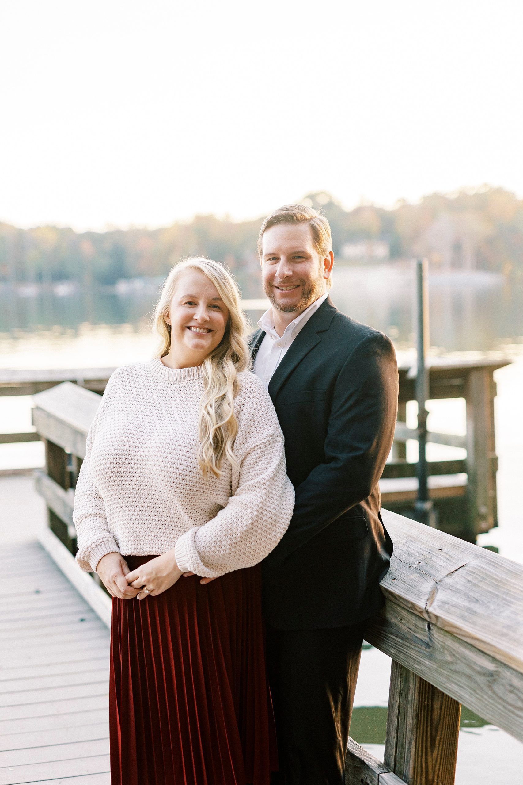 groom holds bride from behind during NC engagement session