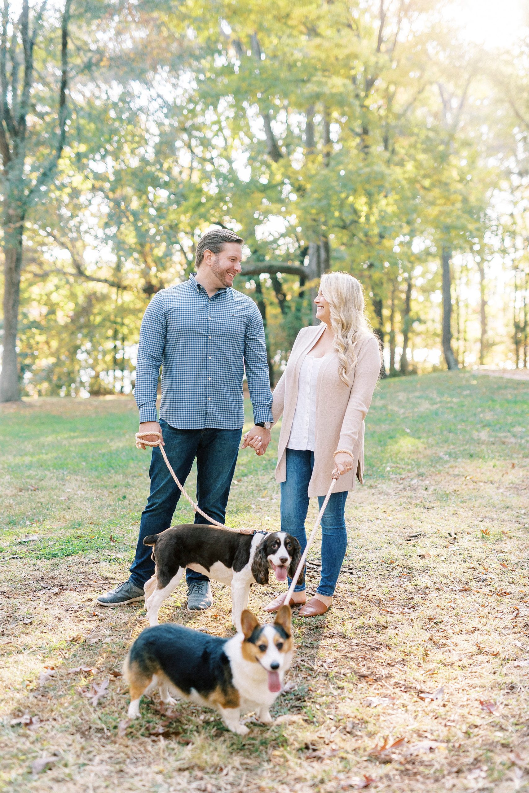 bride and groom walk with dogs at Latta Nature Preserve