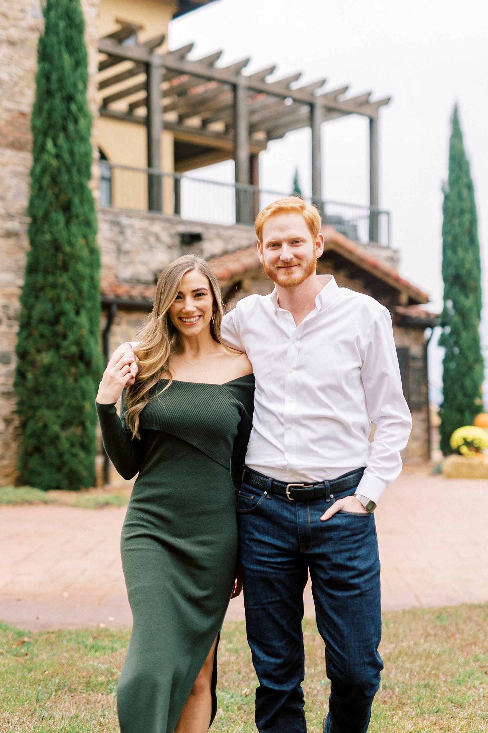 couple walks side by side through courtyard at Raffaldini Vineyards