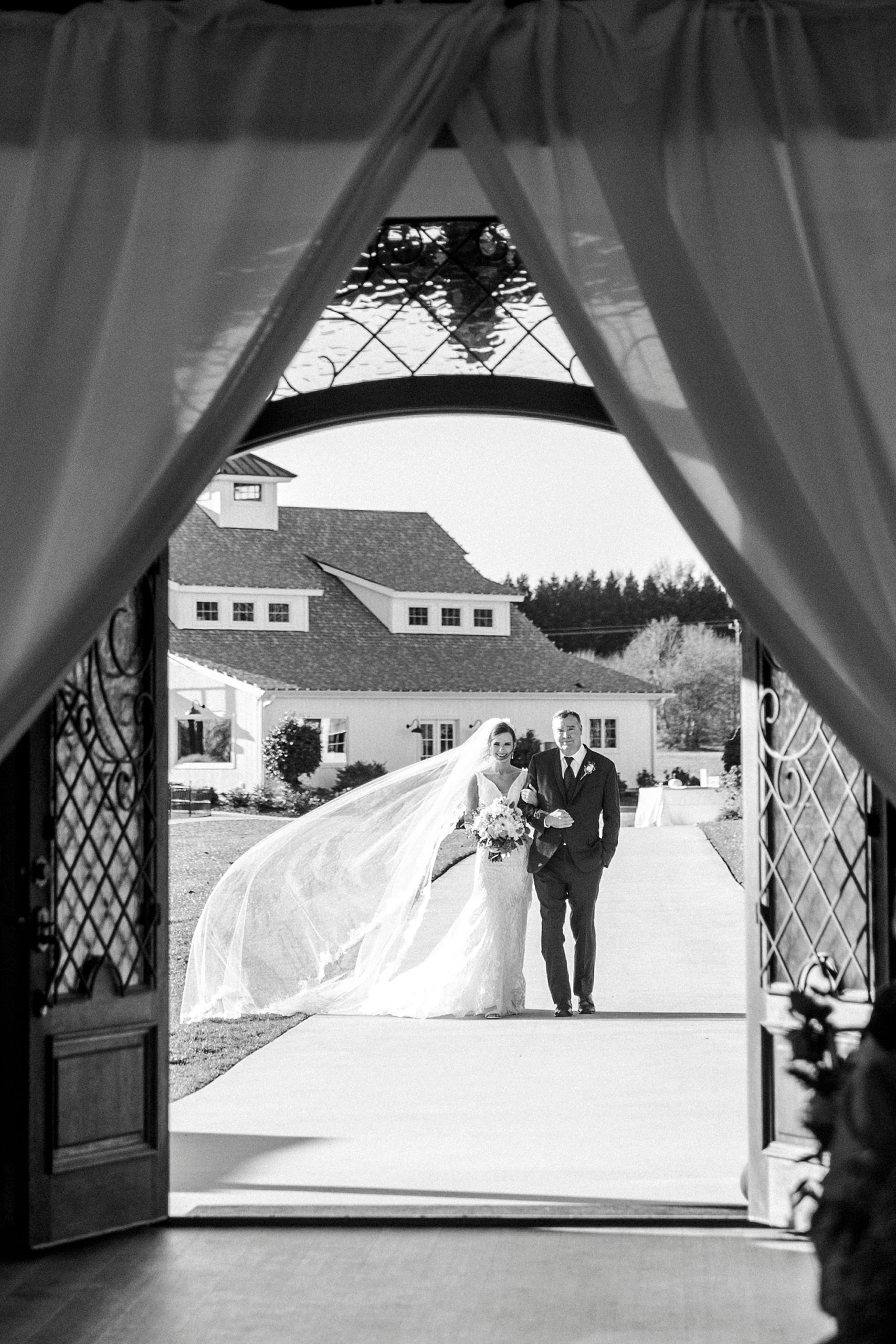 bride and father walk into ceremony at Chickadee Hill Farms
