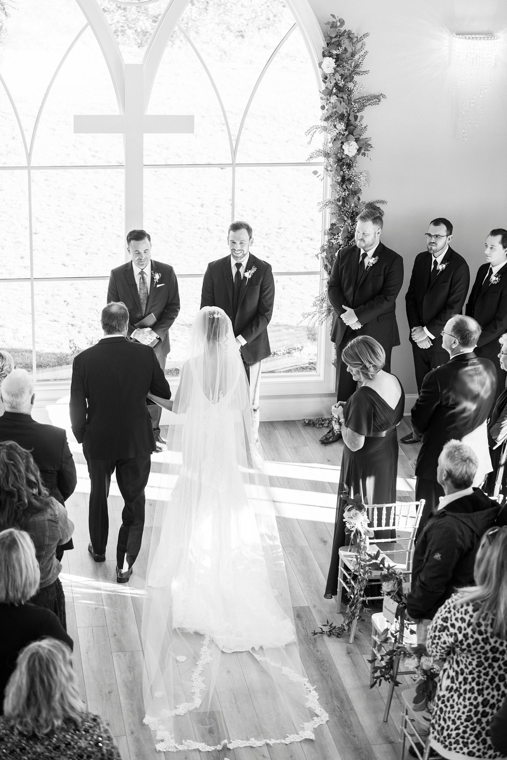 bride approaches groom during ceremony at Chickadee Hill Farms