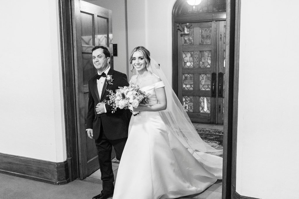 father walks bride into St. James Lutheran Church in Concord NC
