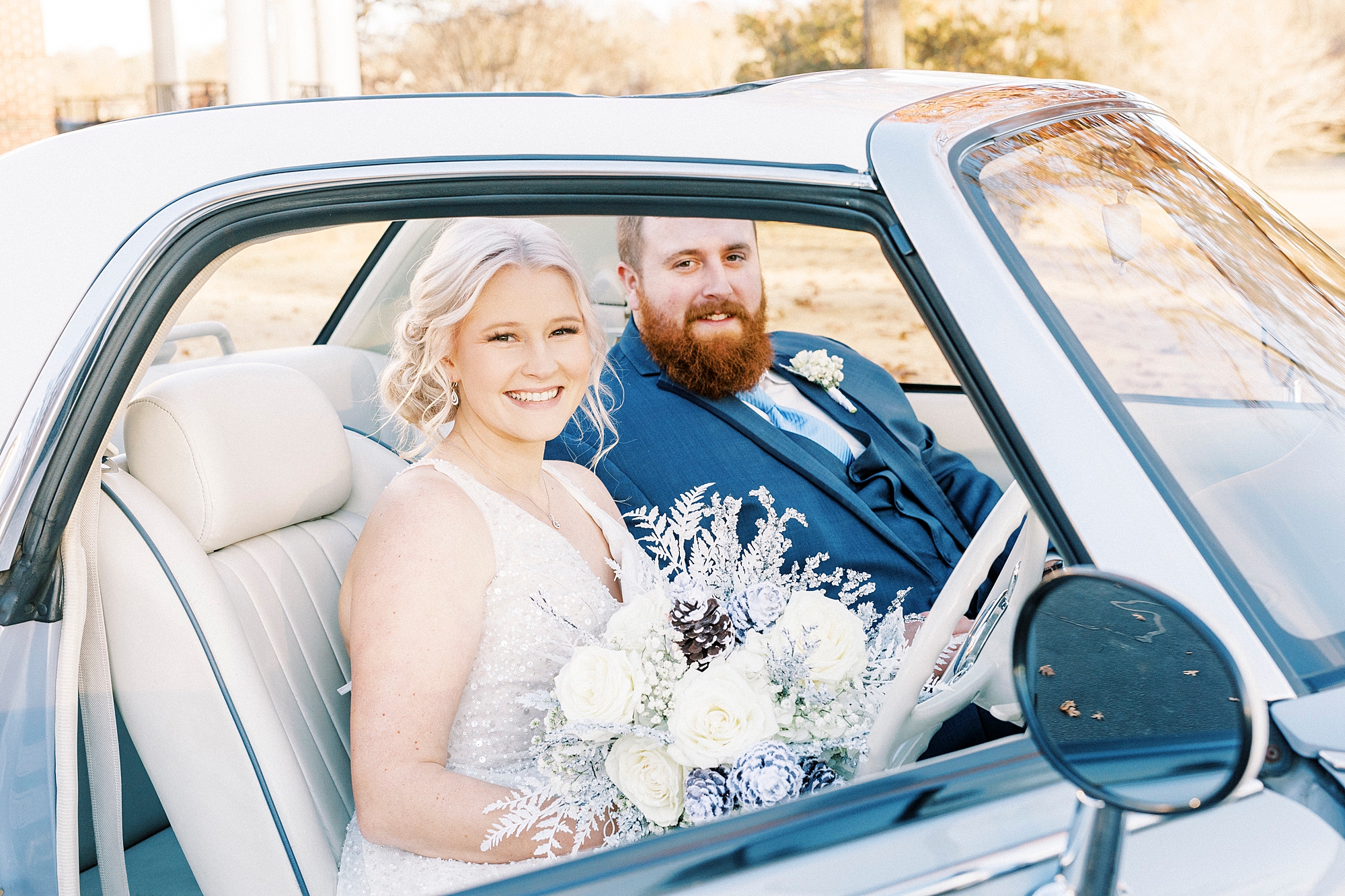 bride and groom sit inside Charlotte the Figgy