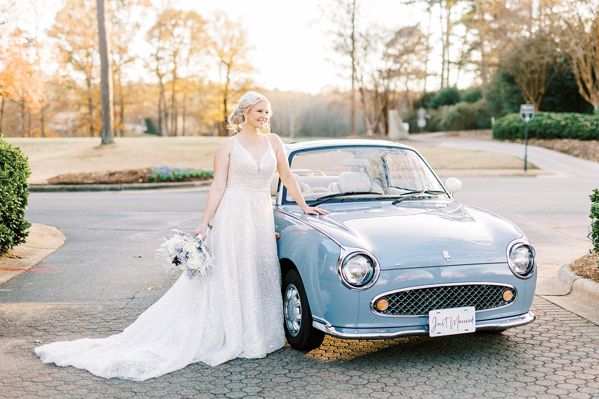 bride leans on hood of purple car outside River Run Country Club