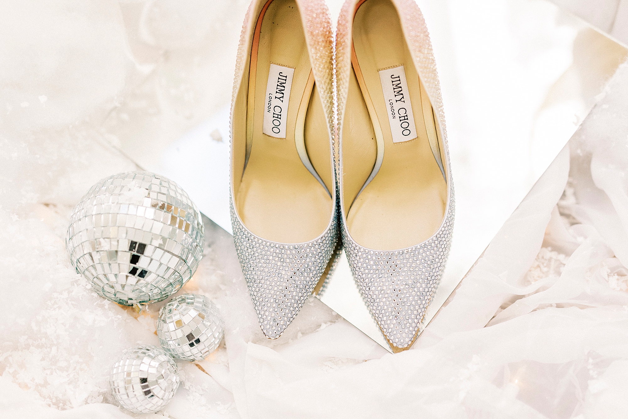bride's silver shoes for winter wonderland wedding at River Run Country Club