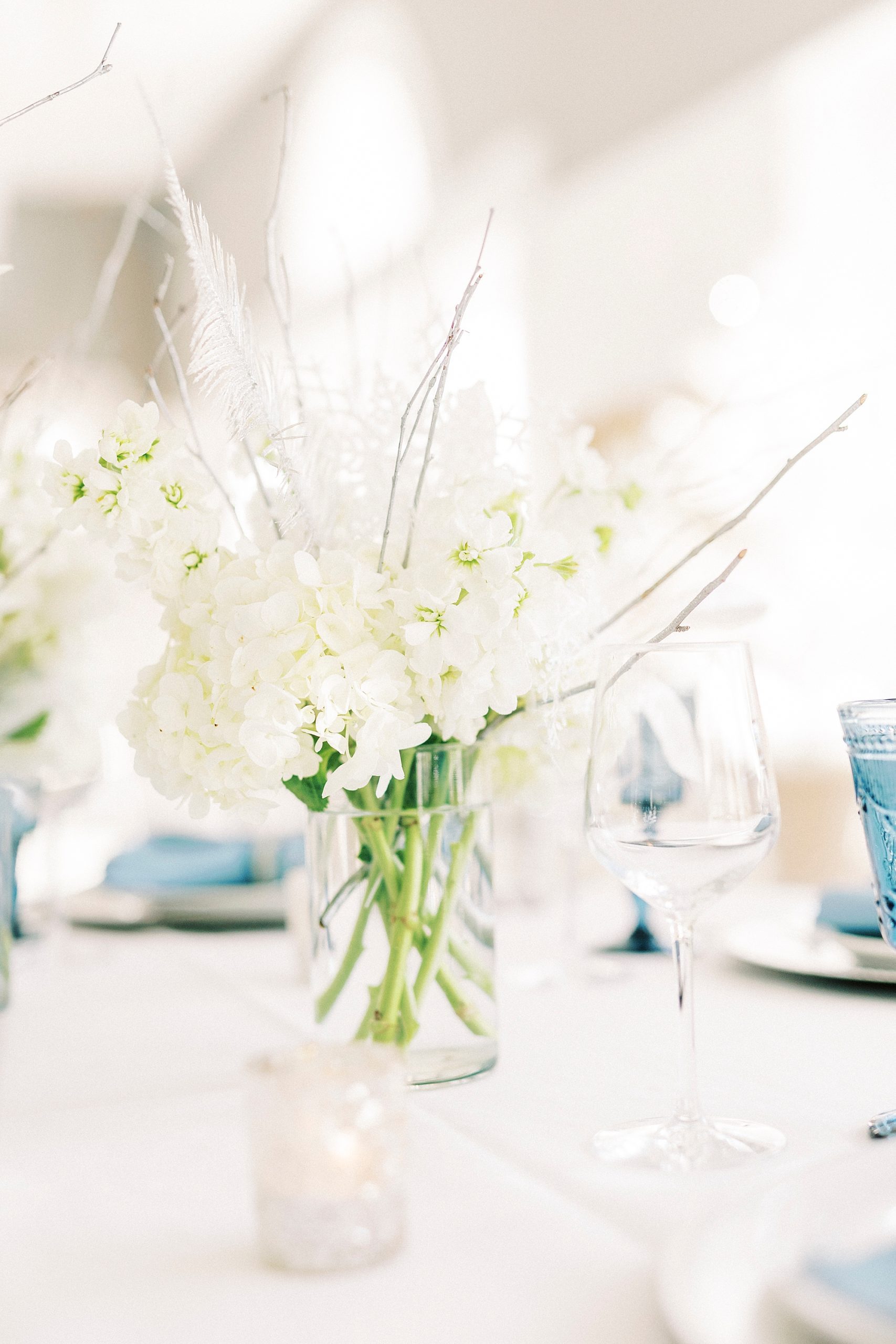 white flower centerpiece for Winter Wonderland wedding at River Run Country Club
