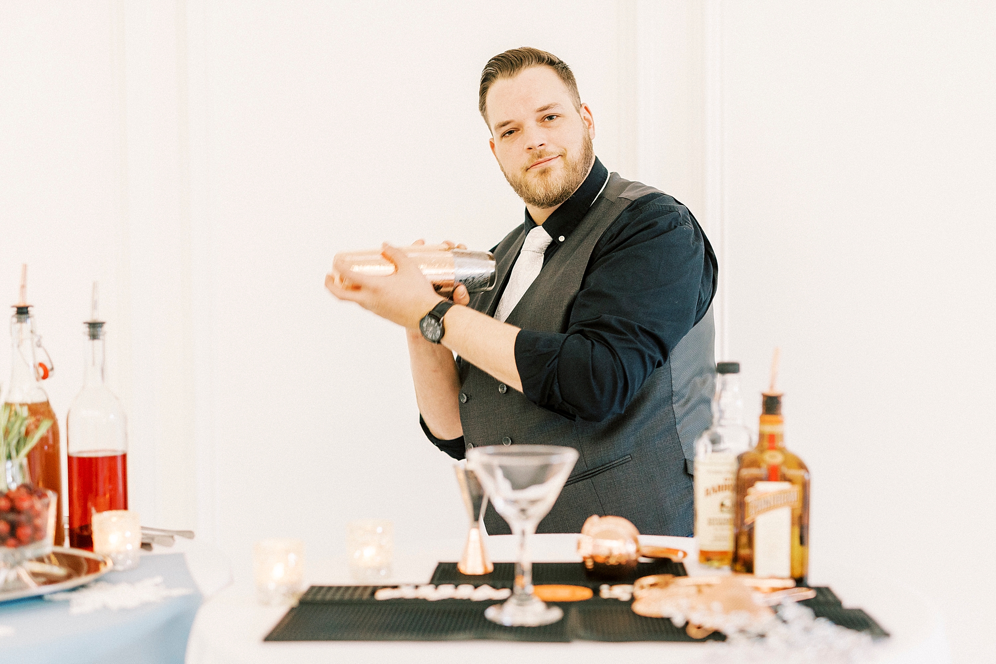 bartender shakes drink during NC wedding reception