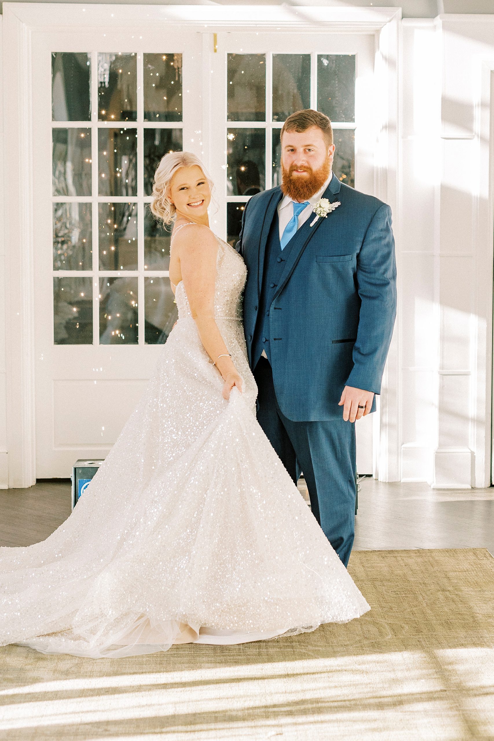 bride and groom pose outside River Run Country Club
