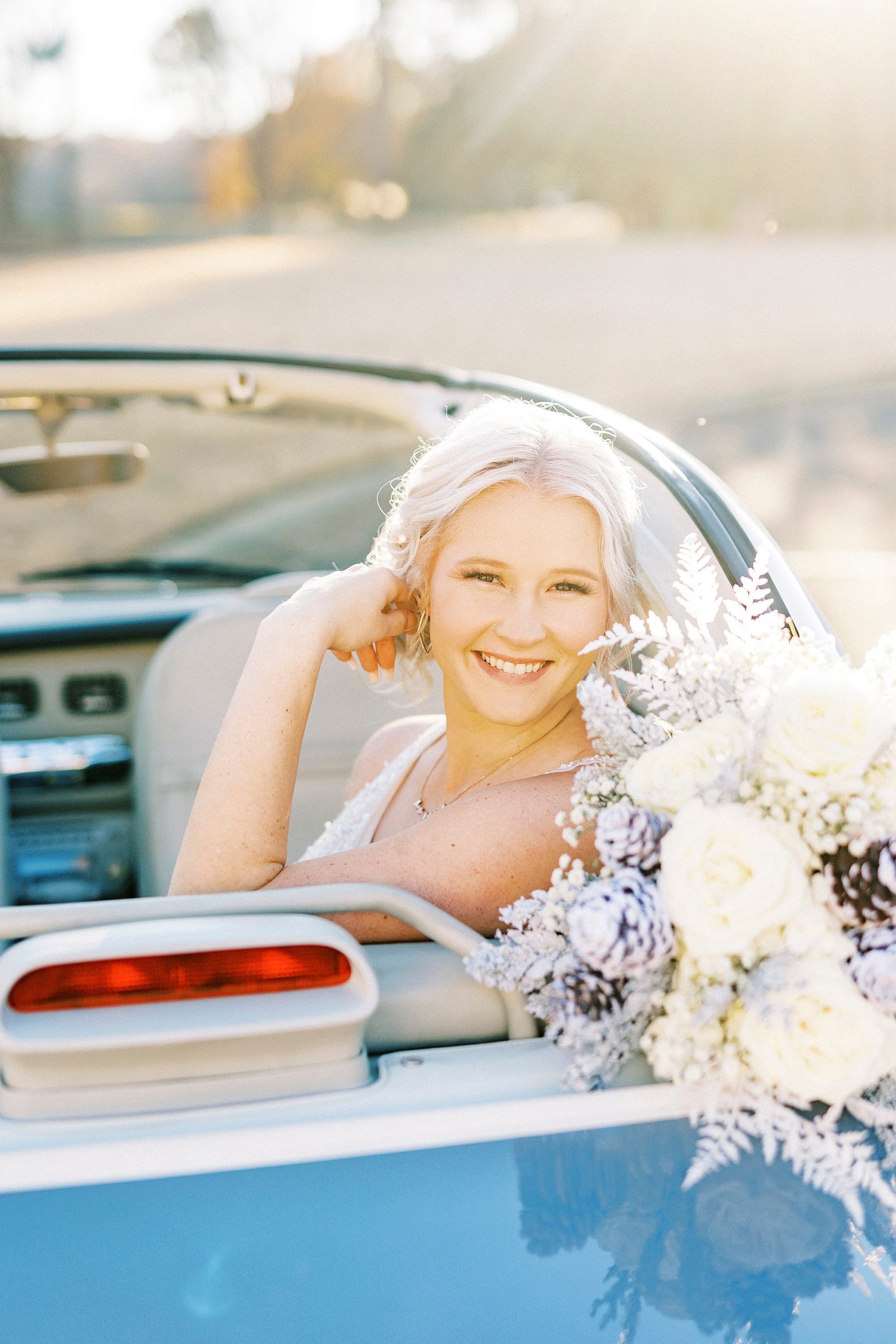 bride sits in Charlotte the Figgy with bouquet on back