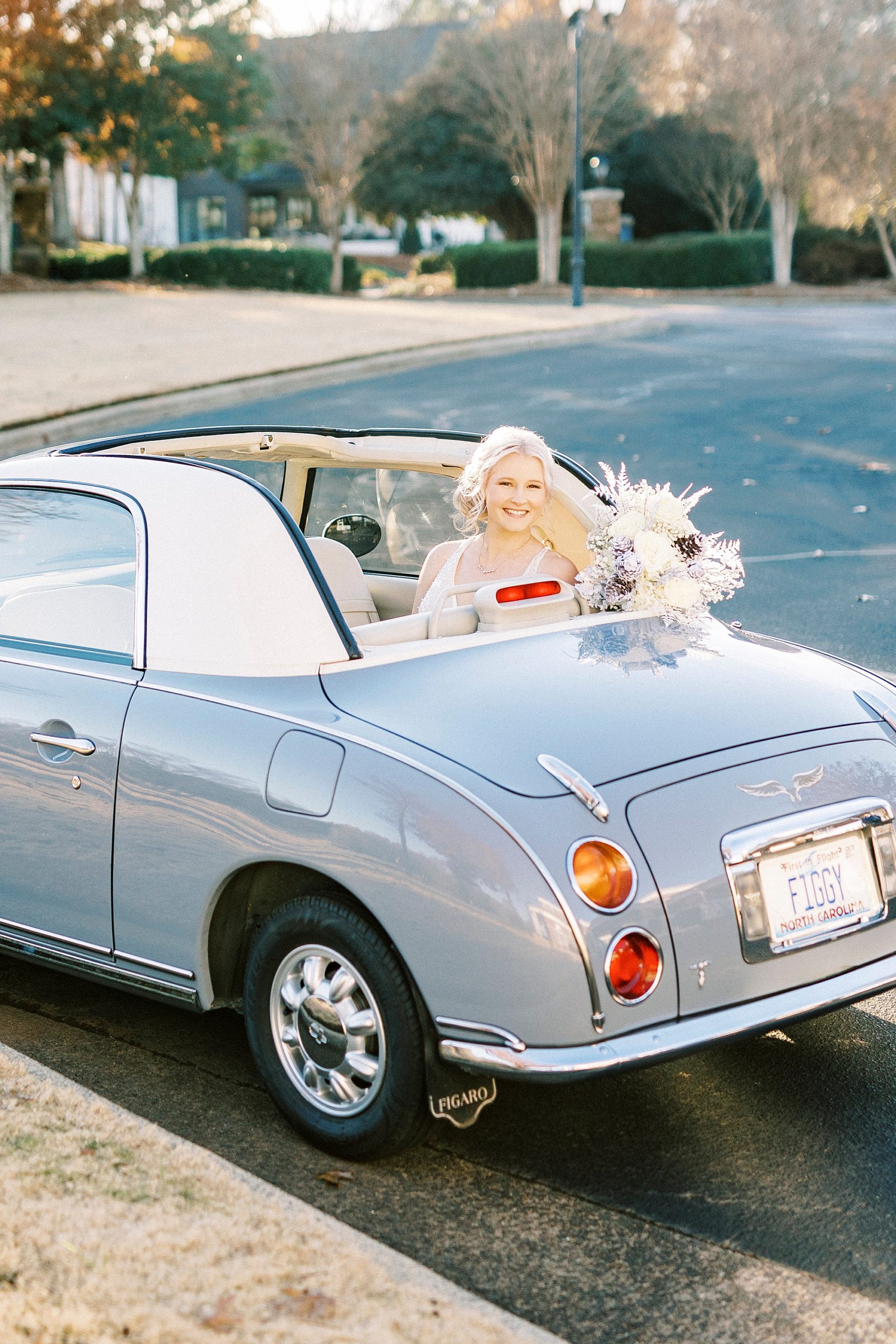 bride poses in Charlotte the Figgy with winter bouquet
